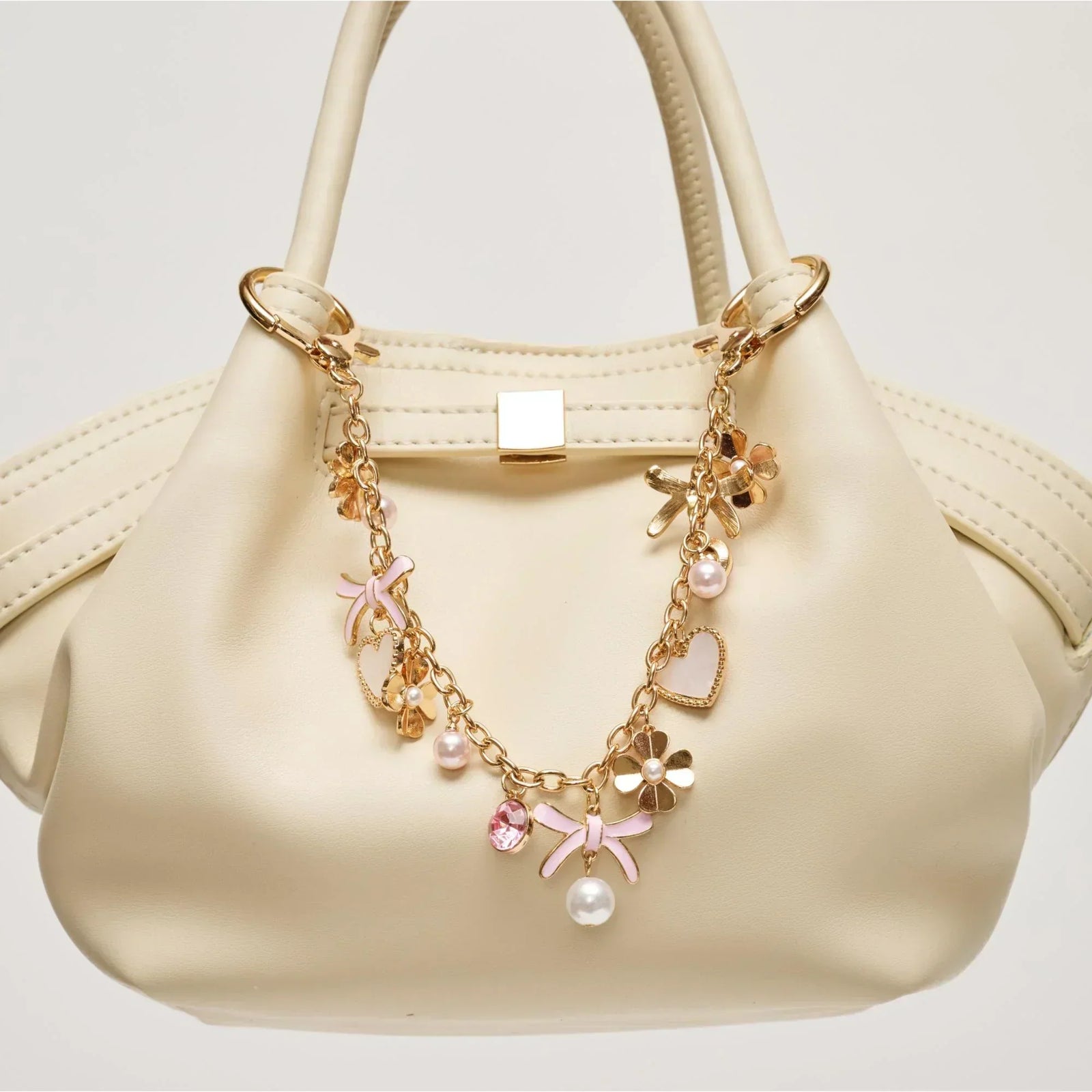 a pink heart and bow hanging purse charm