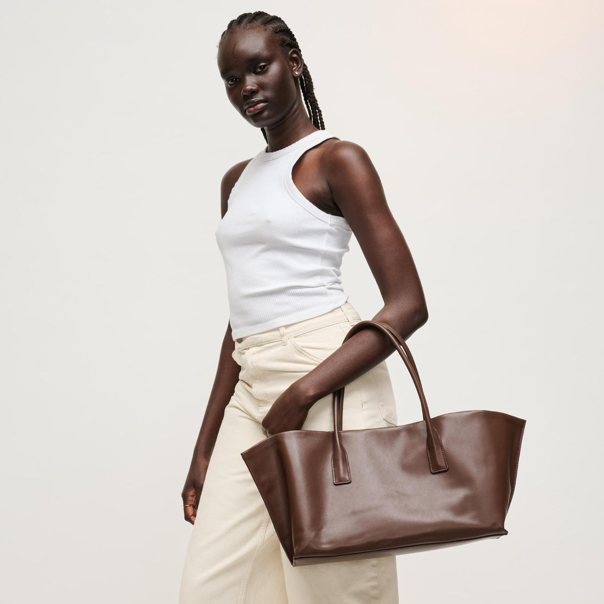 Woman wearing Chocolate Urban Expressions Levi Tote 840504205262 View 3 | Chocolate