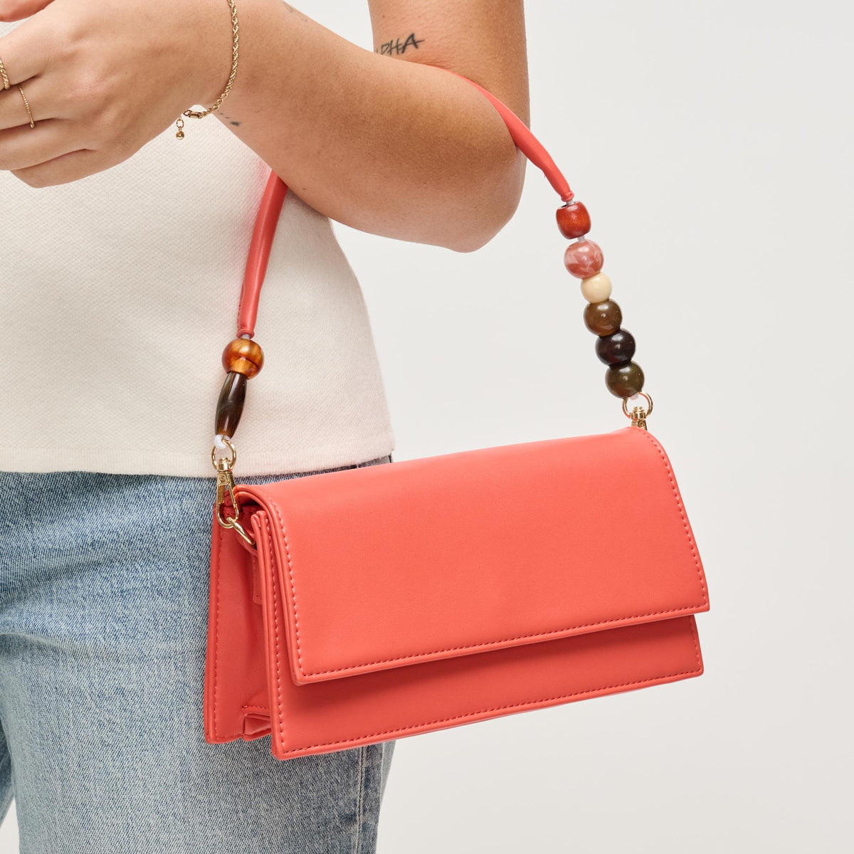 Woman wearing Coral Urban Expressions Brooks Crossbody 840504206658 View 1 | Coral