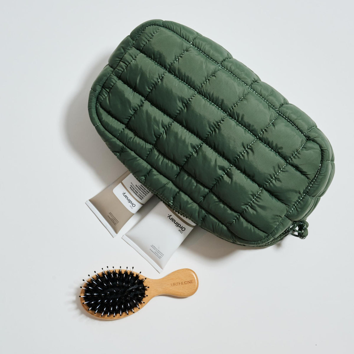 Woman wearing Olive Urban Essentials Cloud Nine - Puffer Cosmetic & Travel Organizer Pouch 840611197702 View 1 | Olive