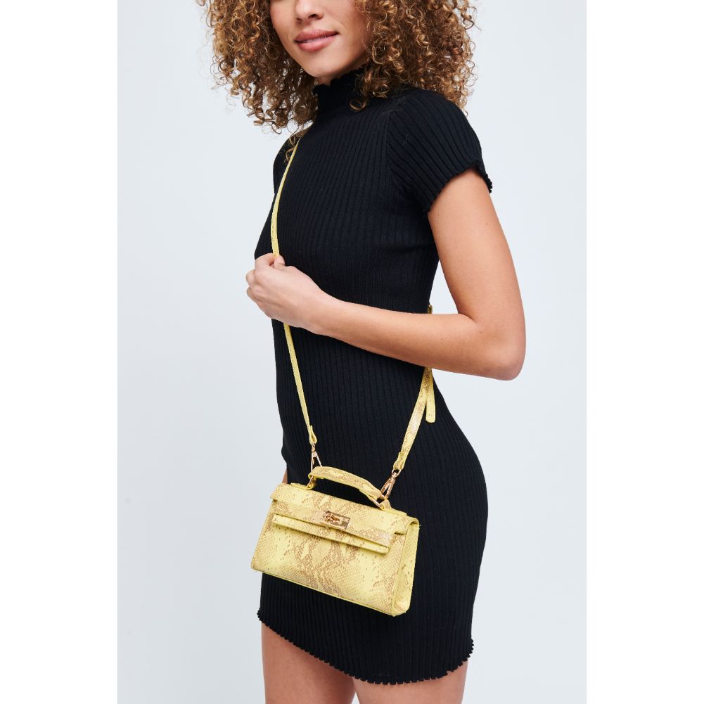 Woman wearing Canary Urban Expressions Georgina Snake Crossbody 840611171986 View 1 | Canary