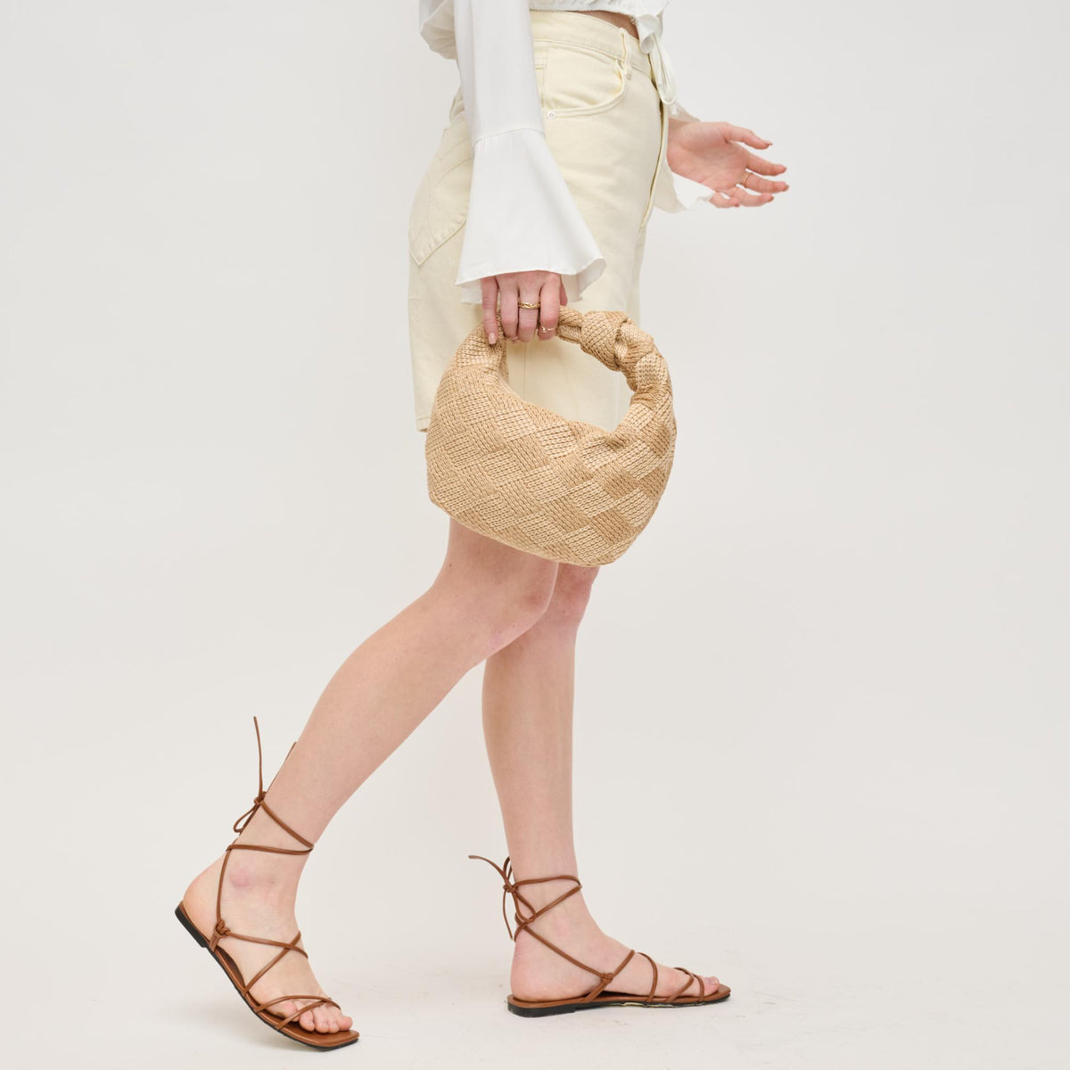 Woman wearing Natural Cream Urban Expressions Tracy - Love Knot Clutch 840611156570 View 4 | Natural Cream