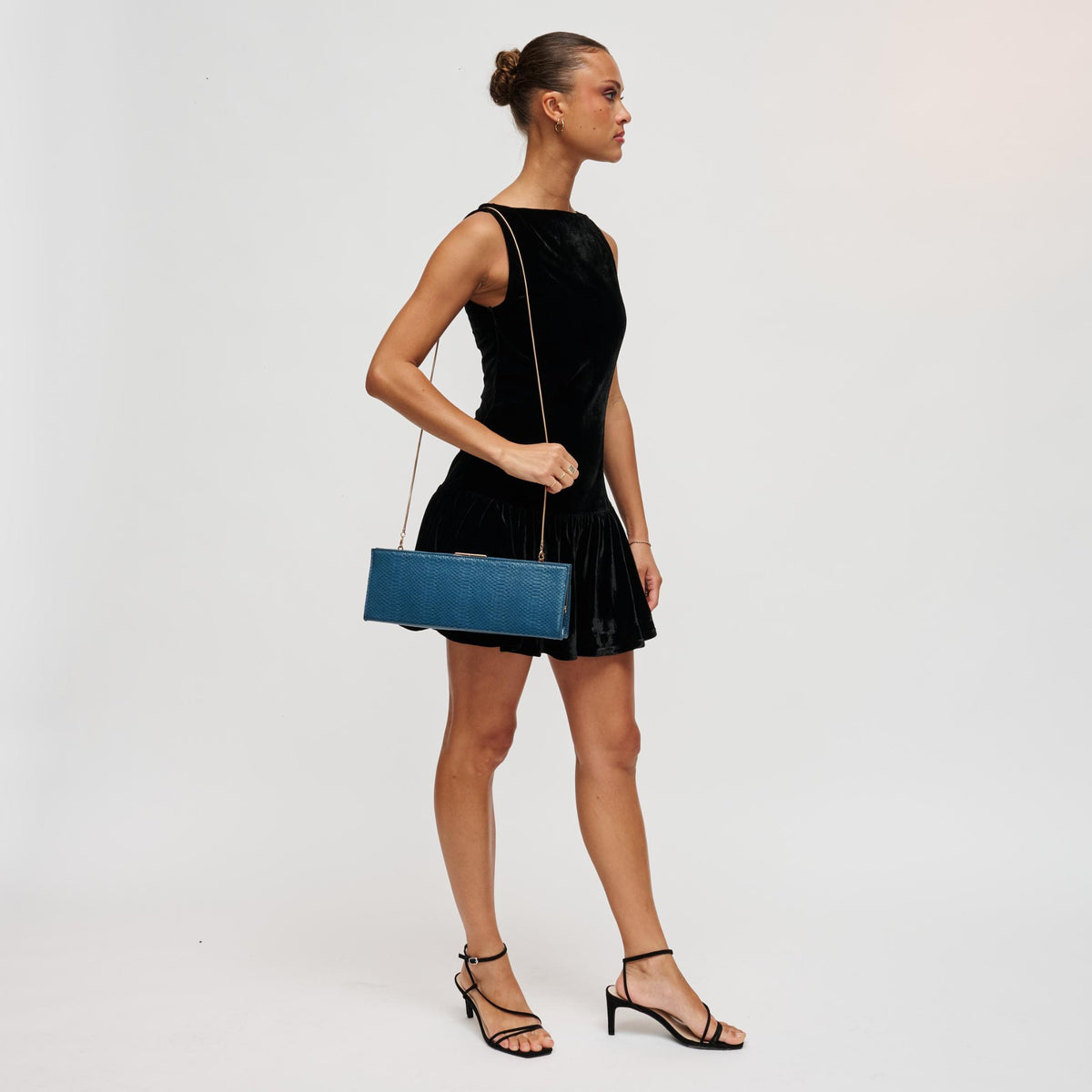 Woman wearing Denim Urban Expressions Nazlee - Snake Clutch 840504212581 View 4 | Denim