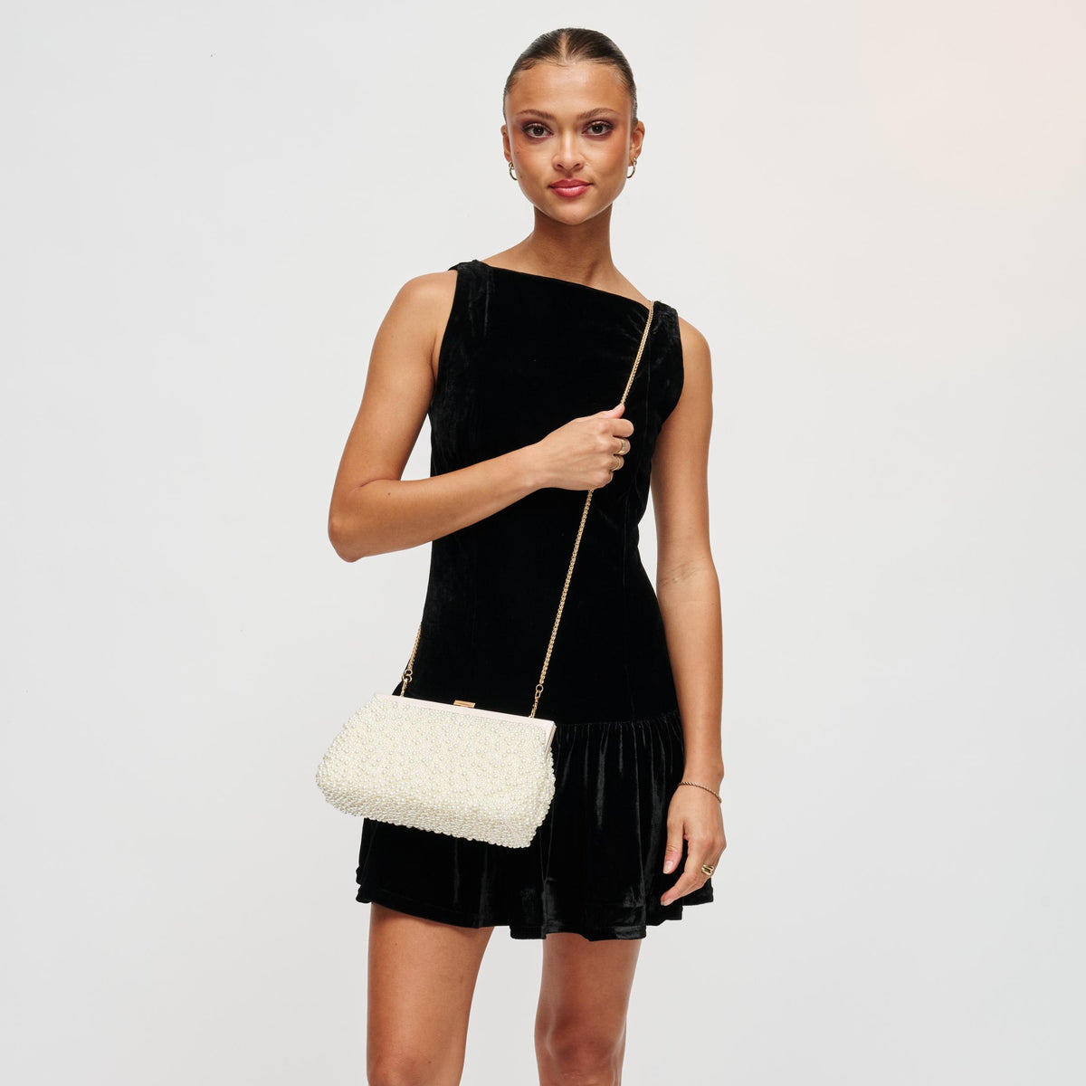 Woman wearing Ivory Urban Expressions Samira Evening Bag 840611193629 View 3 | Ivory