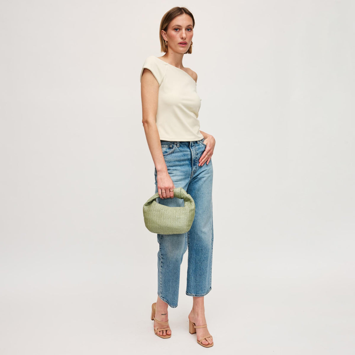 Woman wearing Sage Urban Expressions Tracy - Stripes Clutch 840611141682 View 3 | Sage