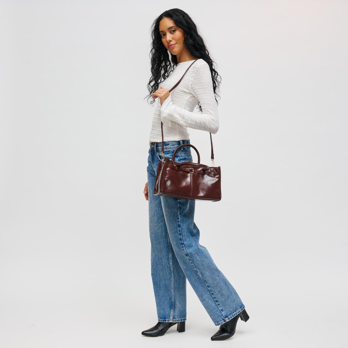 Woman wearing Chocolate Urban Expressions Joanna Crossbody 840611198204 View 2 | Chocolate