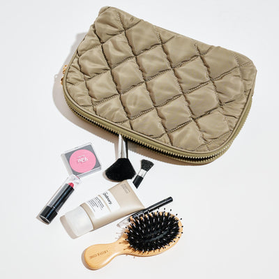Woman wearing Desert Sage Urban Essentials Cloud Kiss - Quilted Puffer Nylon Cosmetic & Travel Organizer Dome Pouch 840611197108 View 1 | Desert Sage