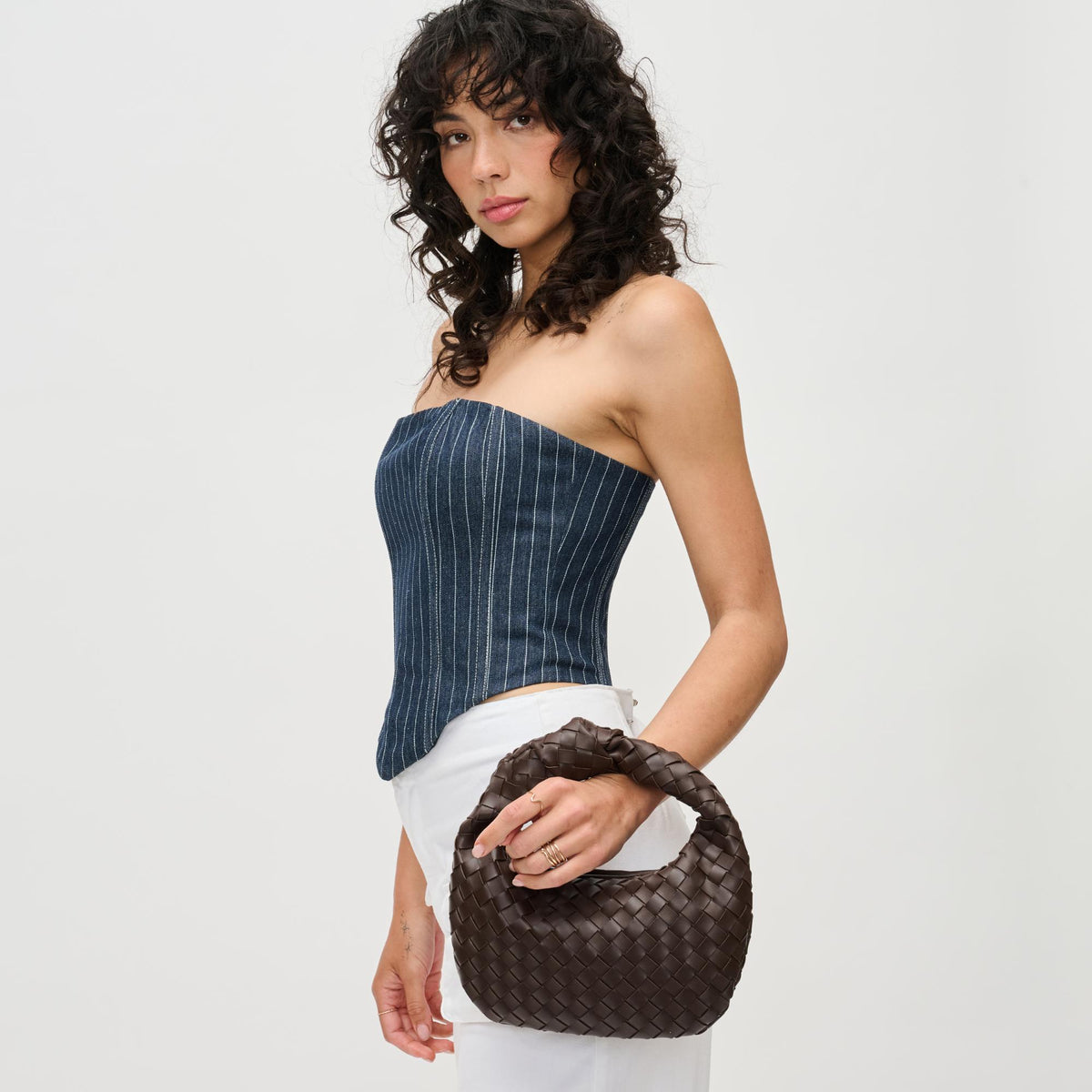Woman wearing Espresso Urban Expressions Tracy - Woven Clutch 840611192943 View 1 | Espresso
