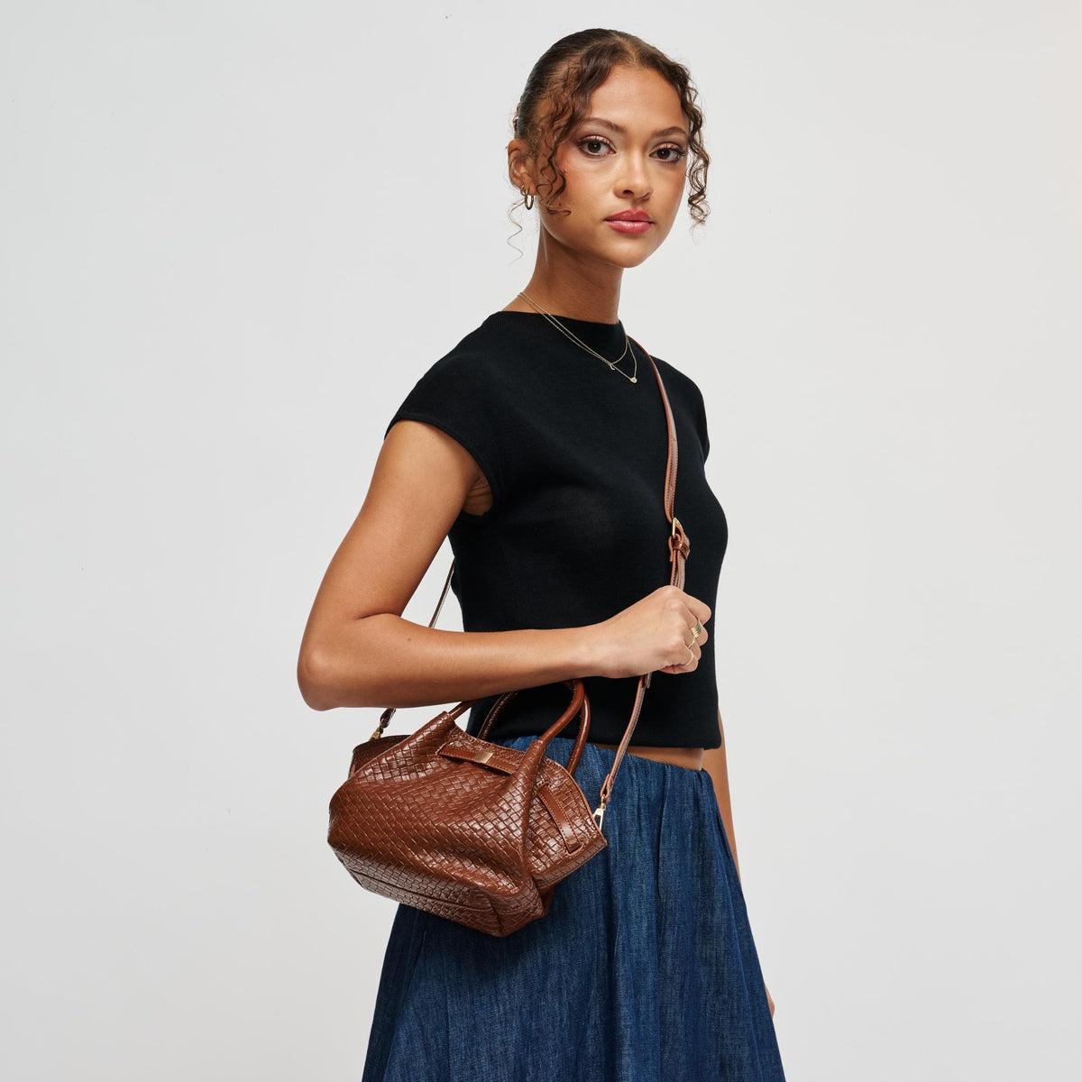 Woman wearing Cognac Urban Expressions Selena - Embossed Woven Crossbody 840504212154 View 2 | Cognac