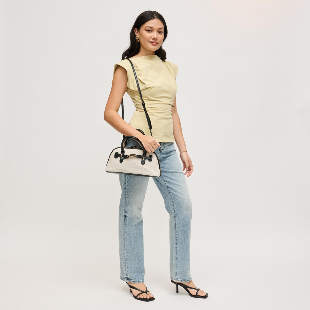 Woman wearing Ivory Black Urban Expressions Amelia Crossbody 840504207884 View 3 | Ivory Black