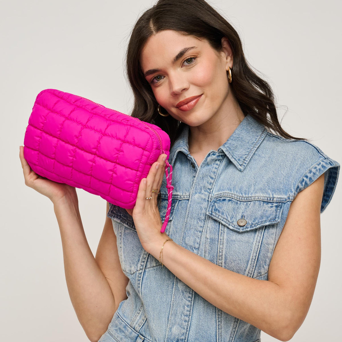 Woman wearing Fuchsia Urban Essentials Cloud Nine - Puffer Cosmetic & Travel Organizer Pouch 840611143778 View 1 | Fuchsia