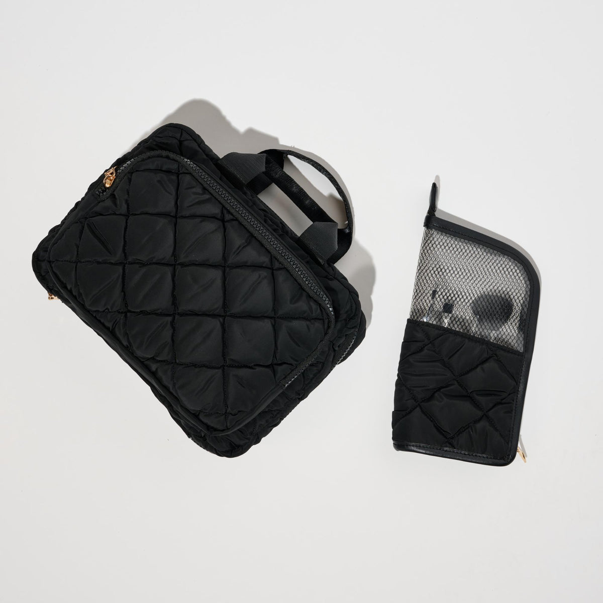 Woman wearing Black Urban Essentials Makeup MVP - Quilted Nylon Brush Holder 840504201141 View 2 | Black