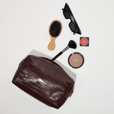 Woman wearing Chocolate Urban Essentials Croc Chic Cosmetic & Travel Organizer Pouch 840611197283 View 1 | Chocolate