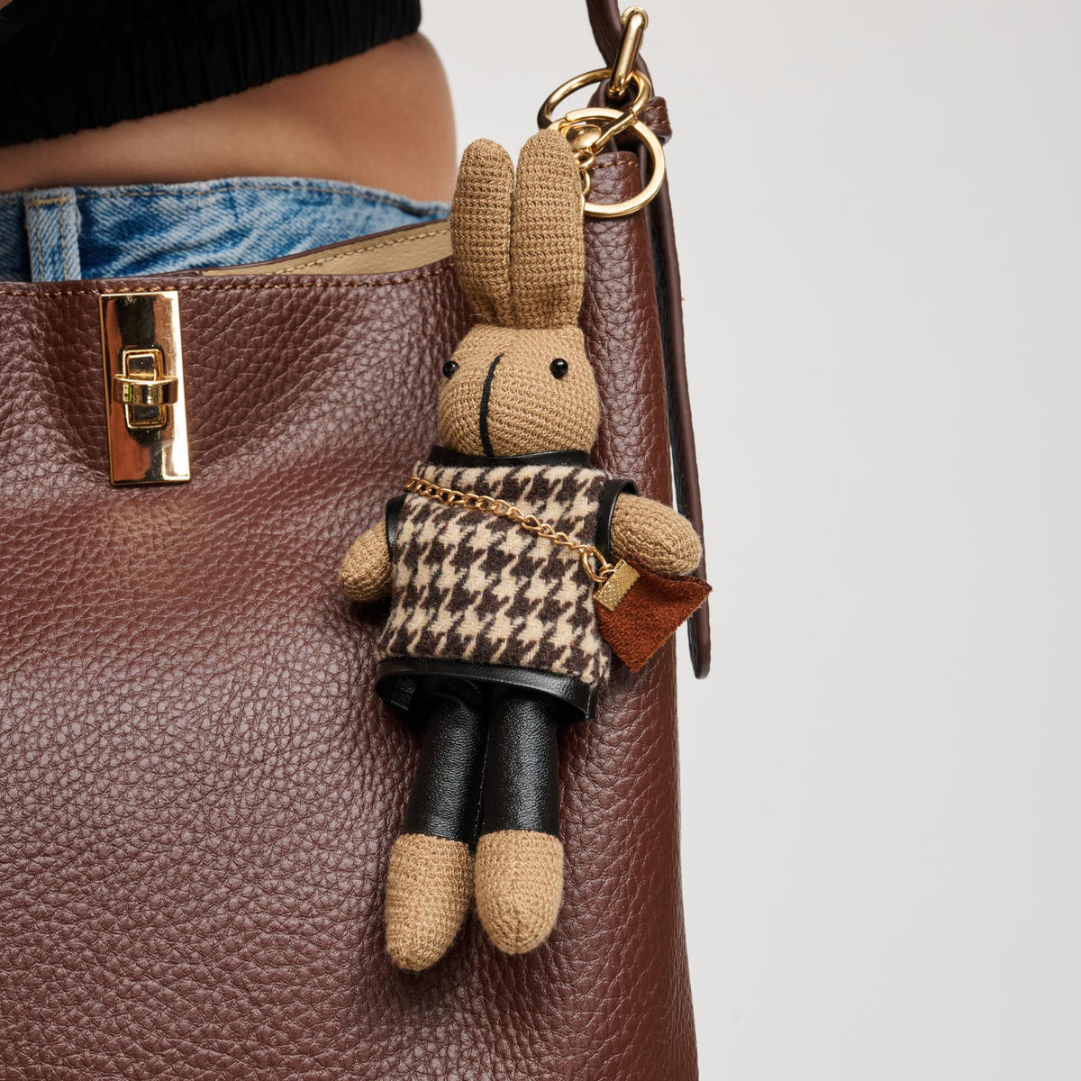 Woman wearing Brown Urban Expressions Kyle Keychain Charm 840504201202 View 1 | Brown