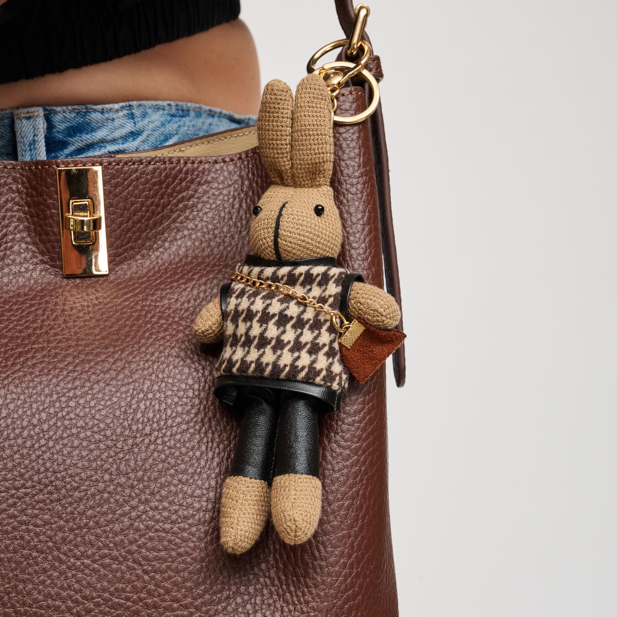 Woman wearing Brown Urban Expressions Kyle Keychain Charm 840504201202 View 1 | Brown