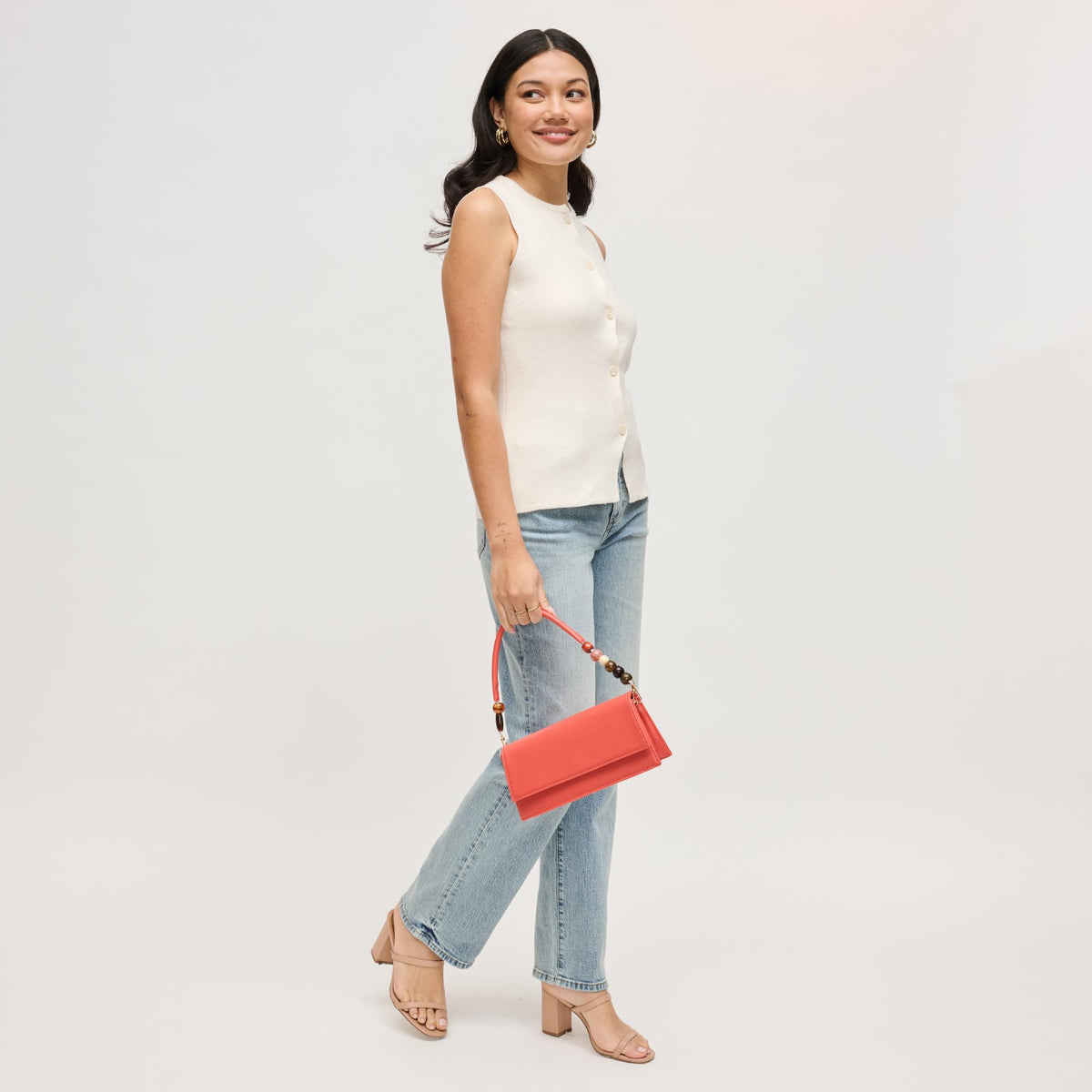 Woman wearing Coral Urban Expressions Brooks Crossbody 840504206658 View 2 | Coral