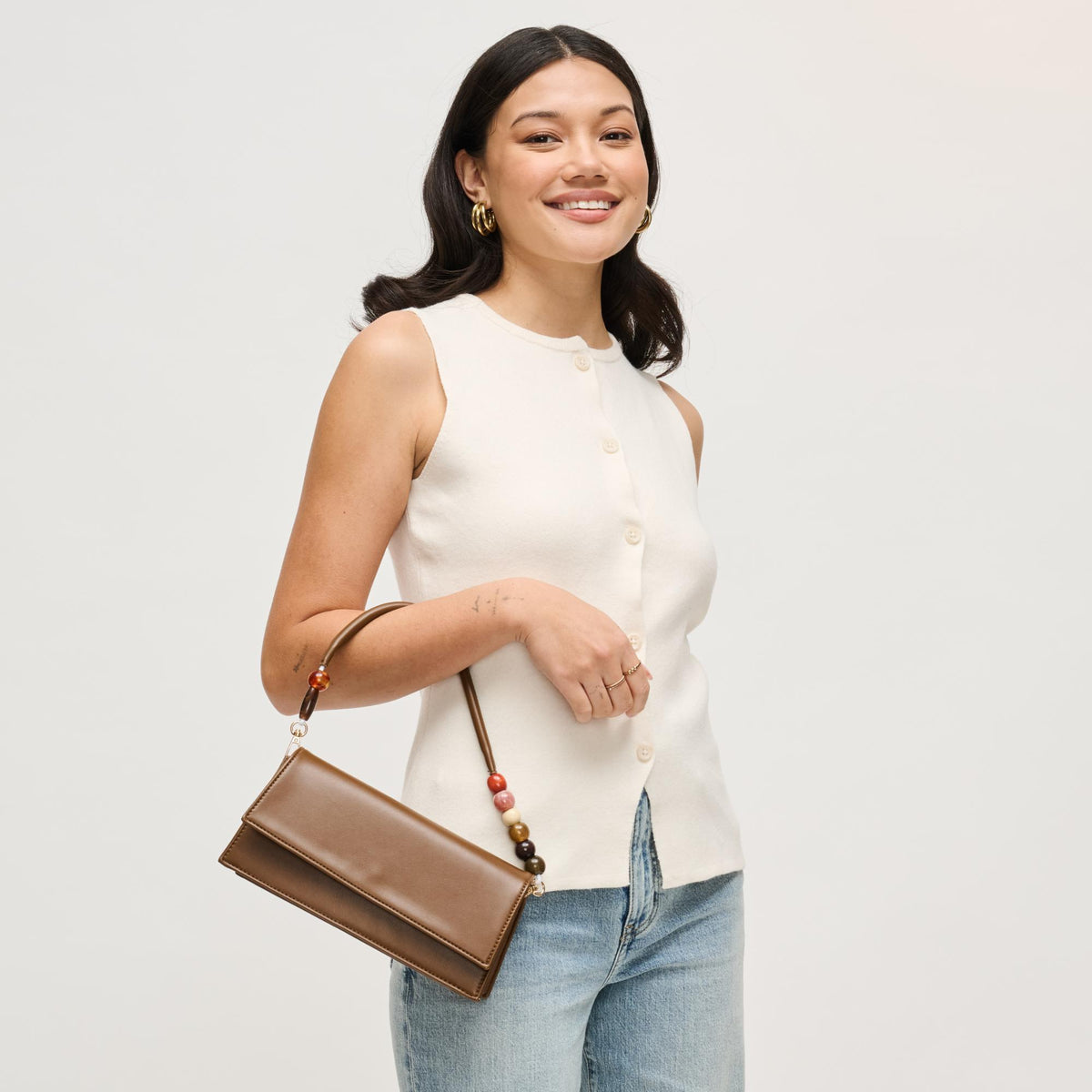 Woman wearing Chocolate Urban Expressions Brooks Crossbody 840504206665 View 1 | Chocolate