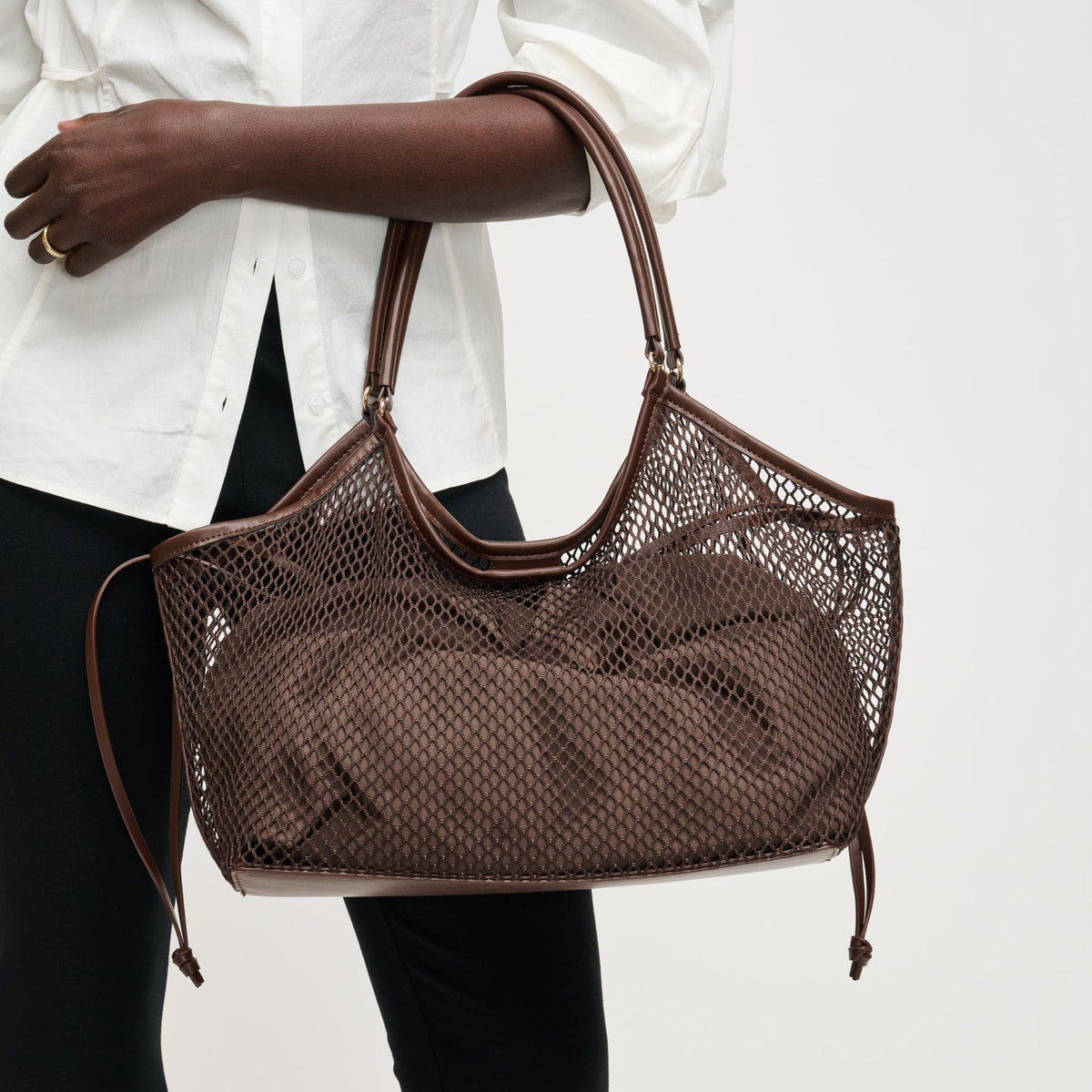Woman wearing Chocolate Urban Expressions Easton Tote 840504205200 View 1 | Chocolate