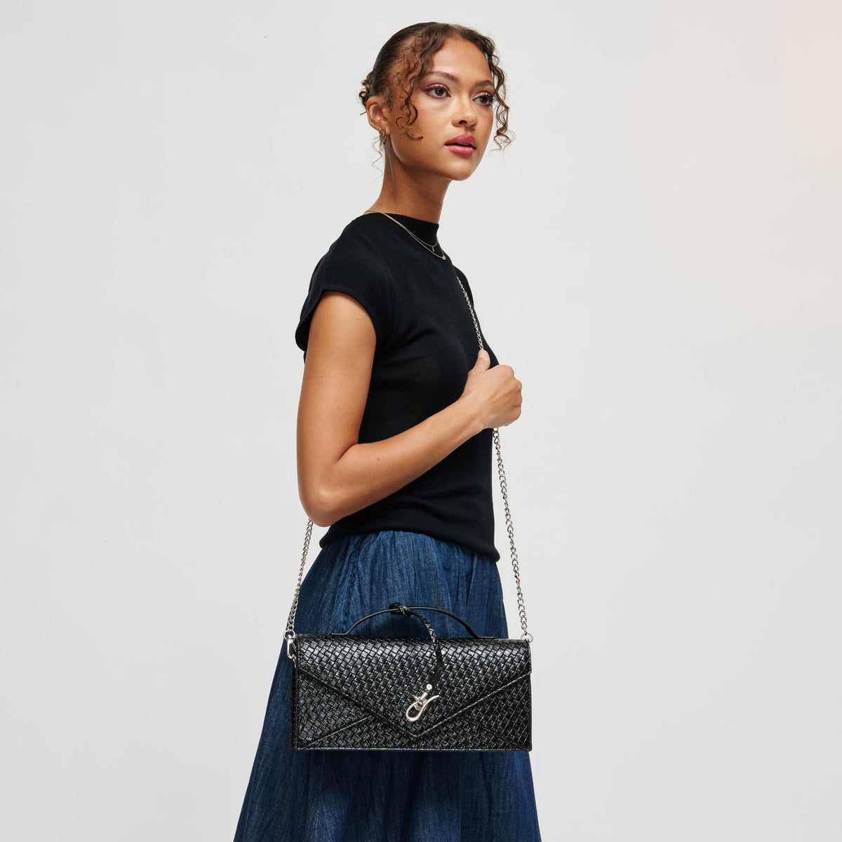 Woman wearing Black Urban Expressions Khaleesi Clutch 840504211874 View 2 | Black