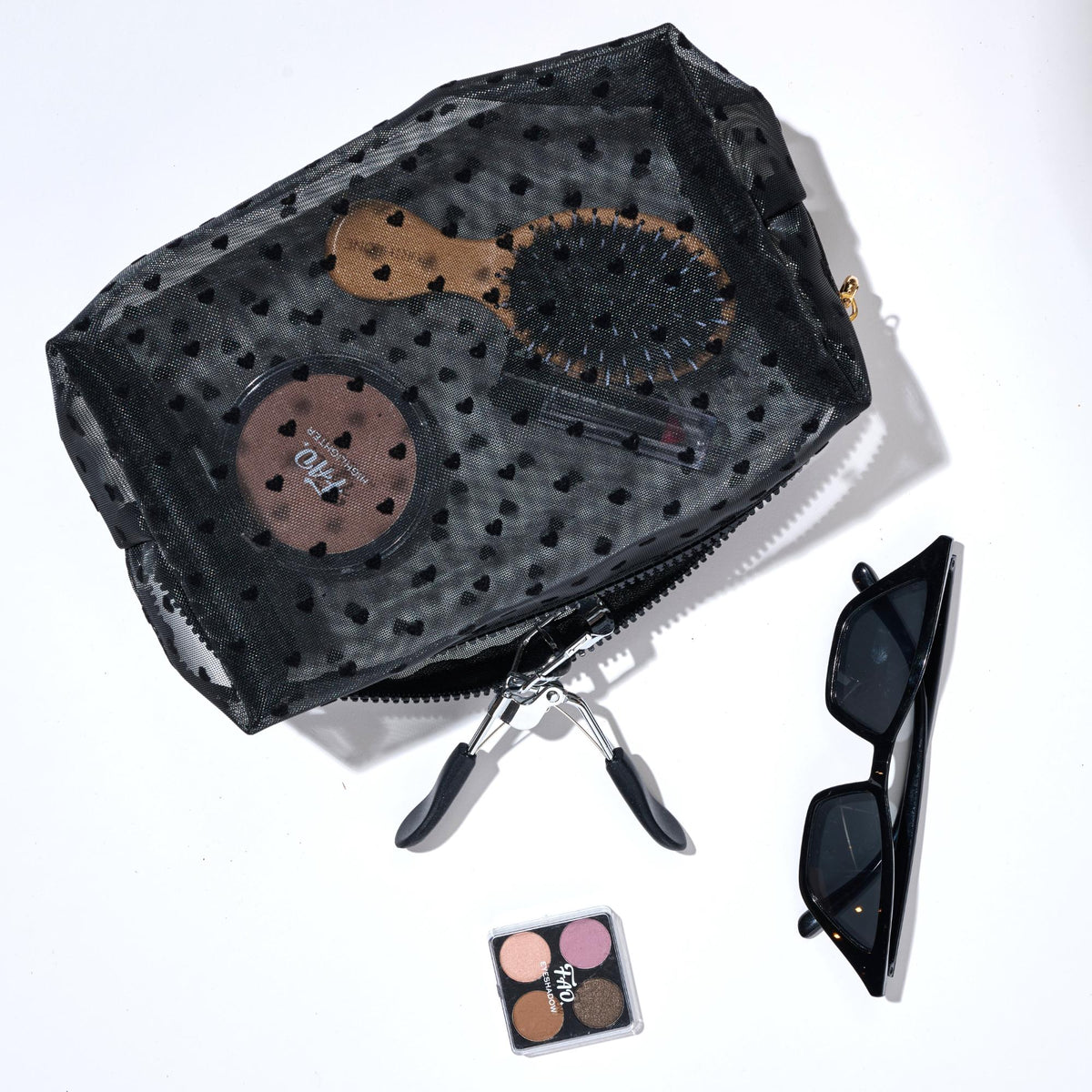 Woman wearing Black Urban Essentials See Through You Cosmetic & Travel Organizer Pouch 840611197078 View 1 | Black