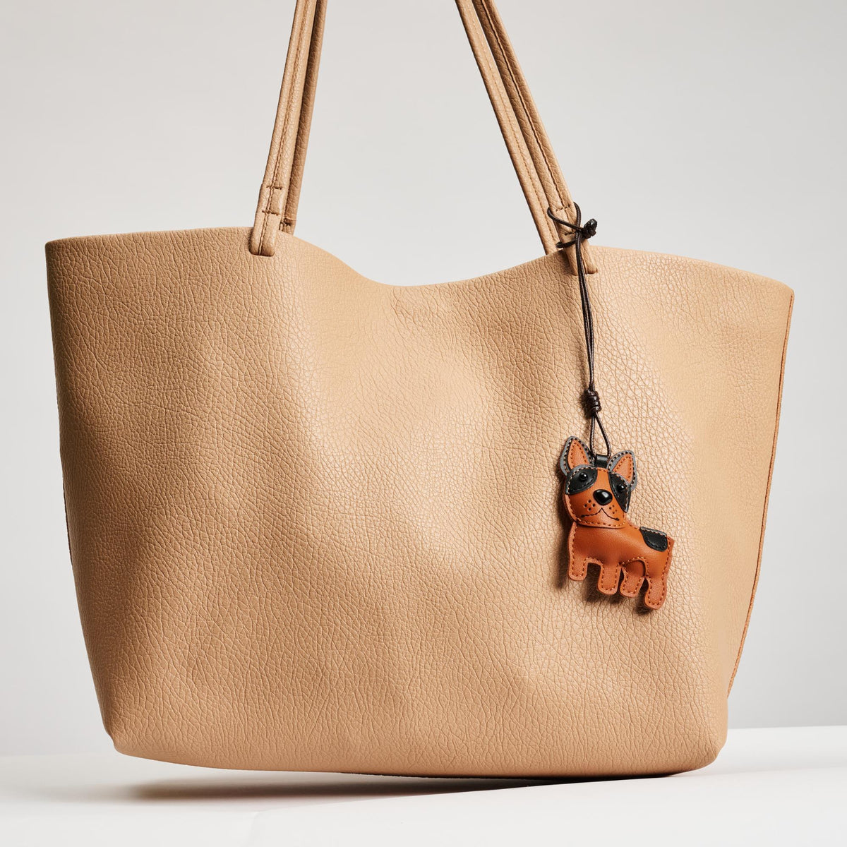 Woman wearing Tan Urban Expressions Bootie Hanging Charm 840611150769 View 2 | Tan