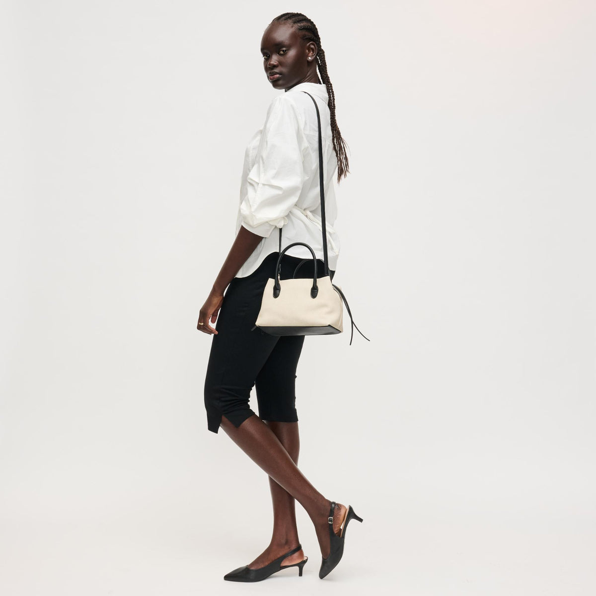 Woman wearing Ivory Black Urban Expressions Logan Crossbody 840504205330 View 2 | Ivory Black