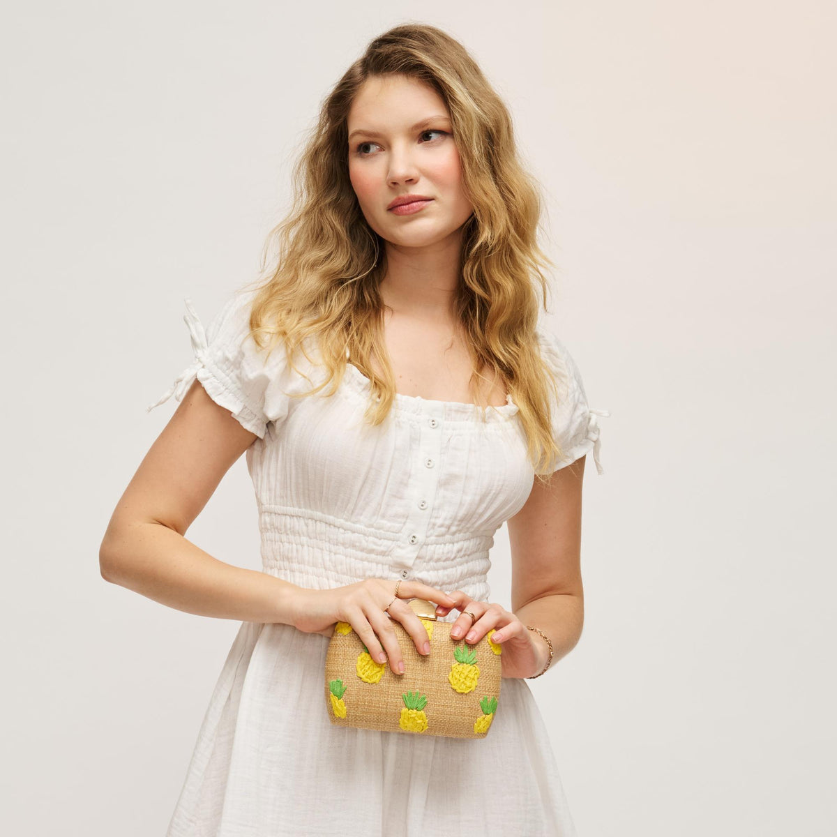 Woman wearing Pineapple Urban Expressions Pebbles Evening Bag 840504207938 View 3 | Pineapple