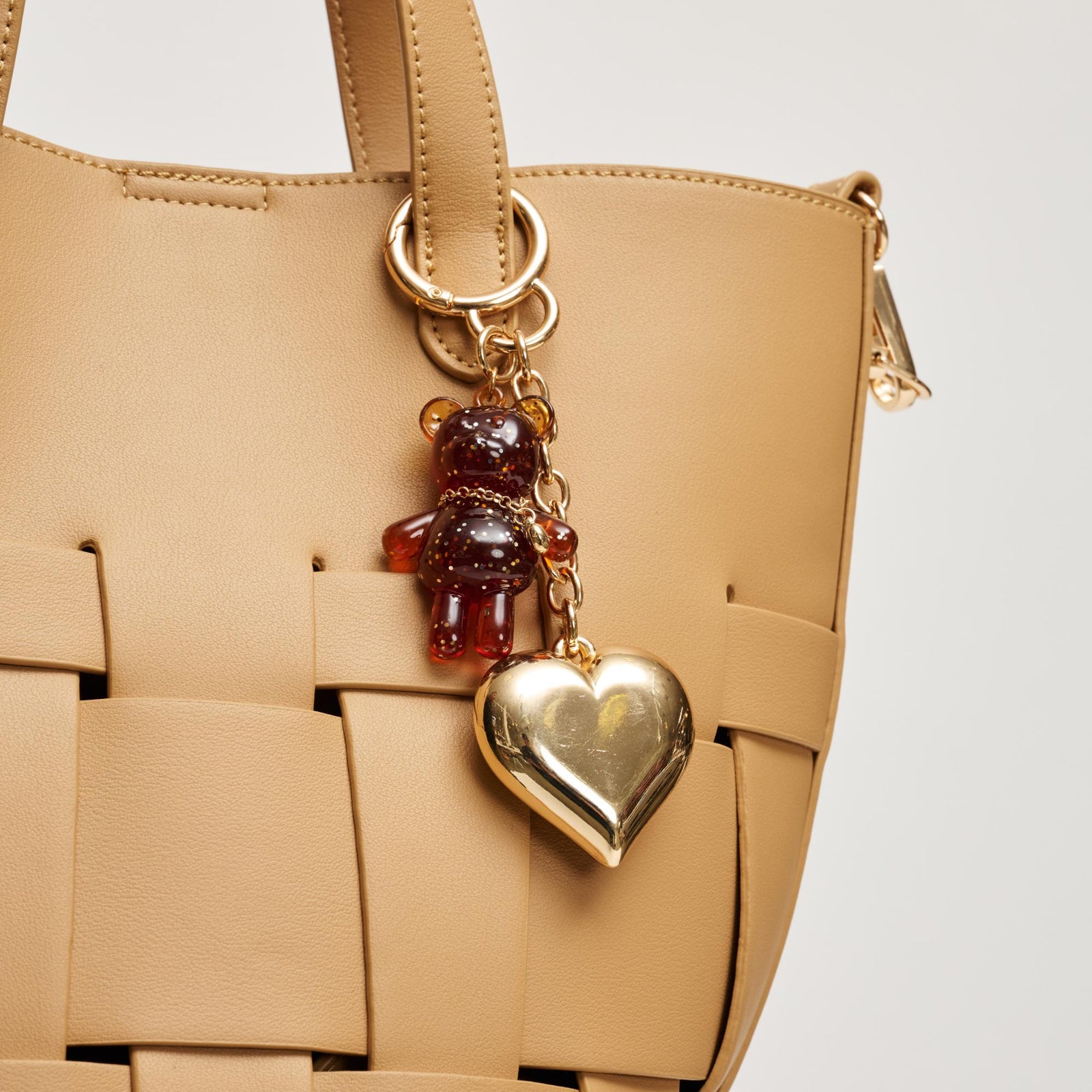 Woman wearing Gold Urban Expressions Cocoa Keychain Charm 840504209147 View 1 | Gold