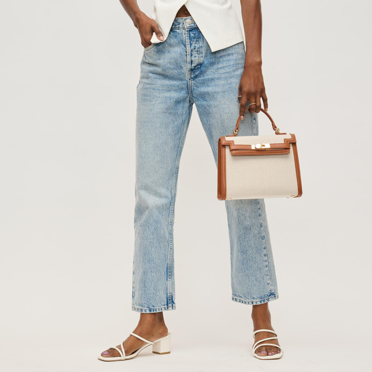 Woman wearing Tan Ivory Urban Expressions Cher Clutch 840611146311 View 2 | Tan Ivory