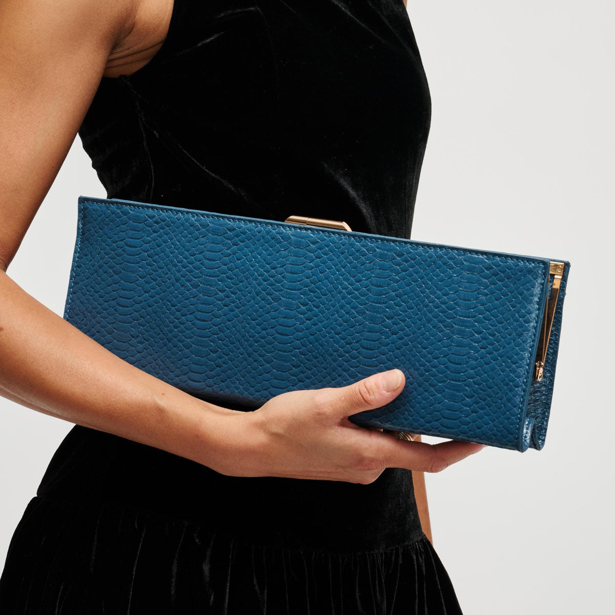 Woman wearing Denim Urban Expressions Nazlee - Snake Clutch 840504212581 View 1 | Denim