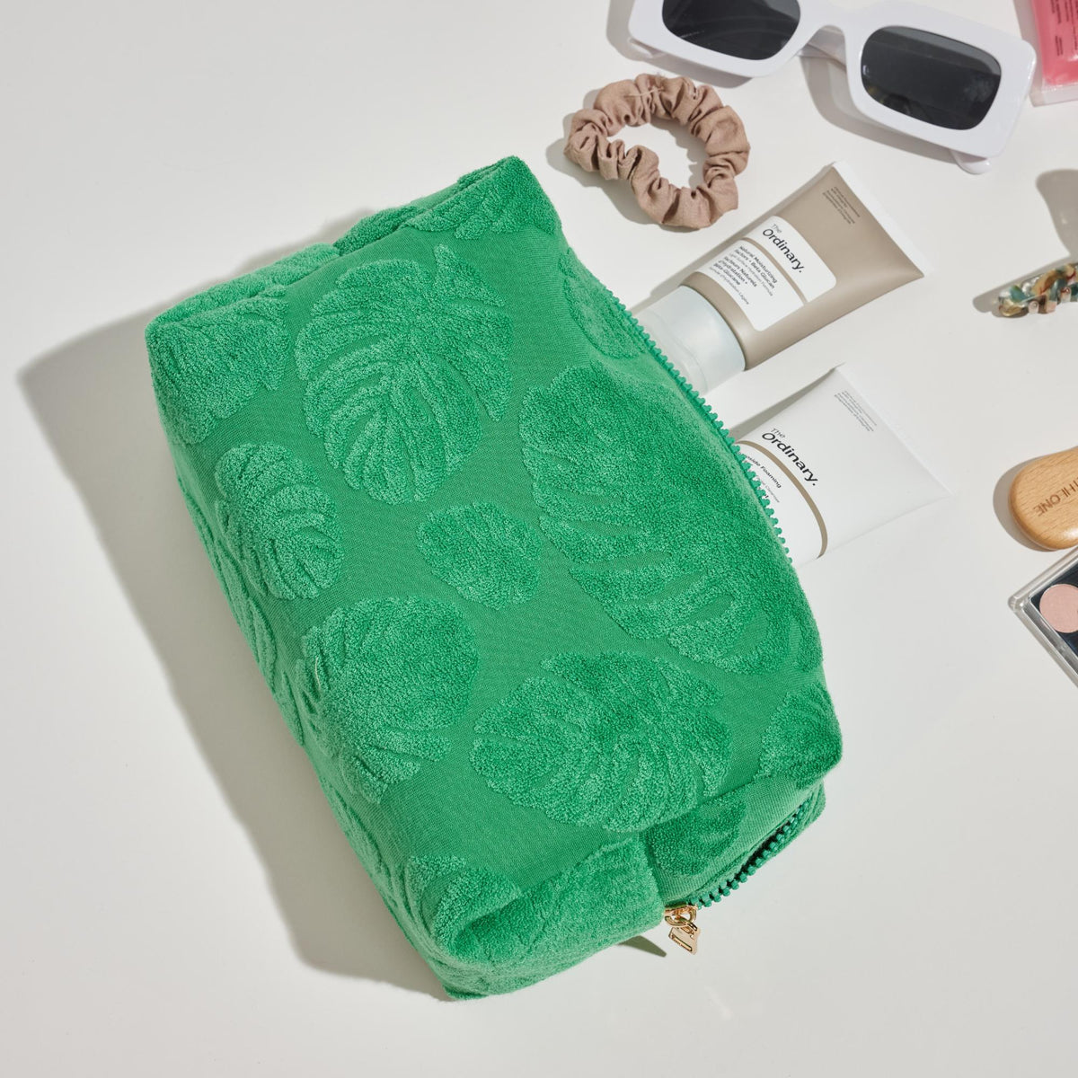 Woman wearing Green Urban Essentials Palm Breeze Cosmetic & Travel Organizer Pouch 840611195340 View 2 | Green