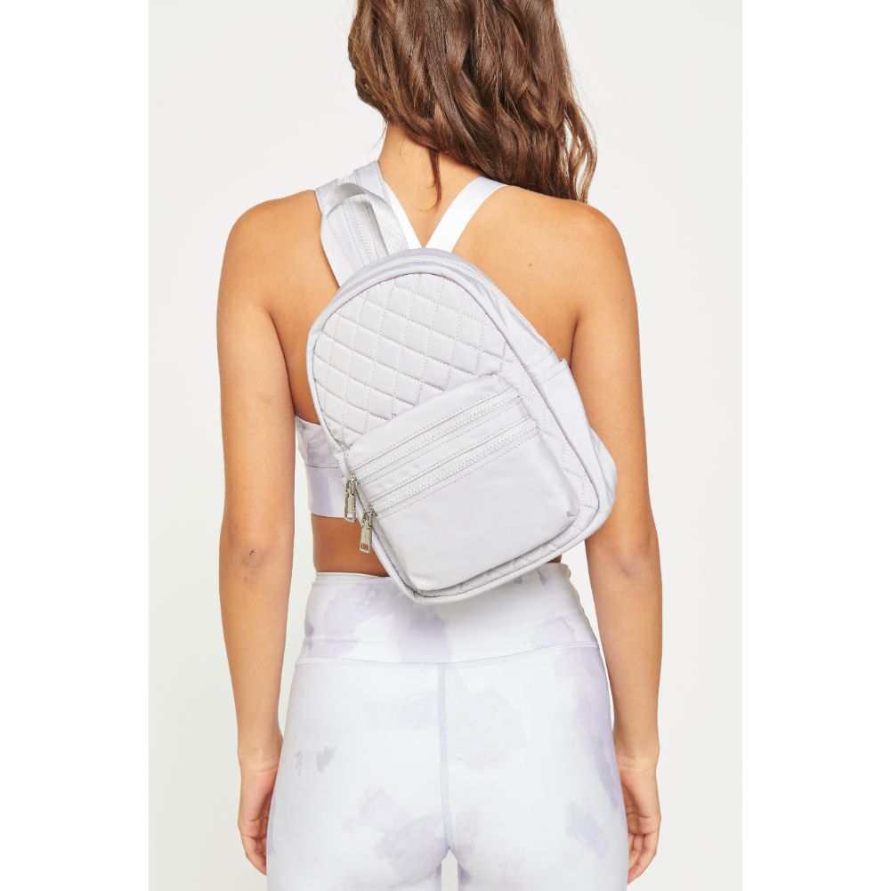 Woman wearing Grey Urban Expressions Brynlee Sling Backpack 840611180469 View 3 | Grey