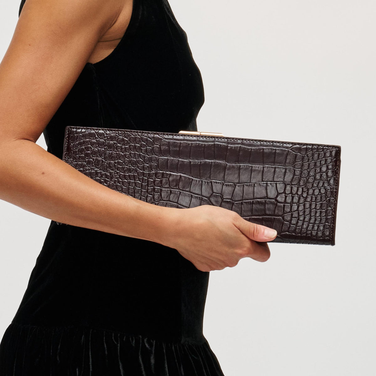 Woman wearing Chocolate Urban Expressions Nazlee - Croc Clutch 840504212611 View 1 | Chocolate