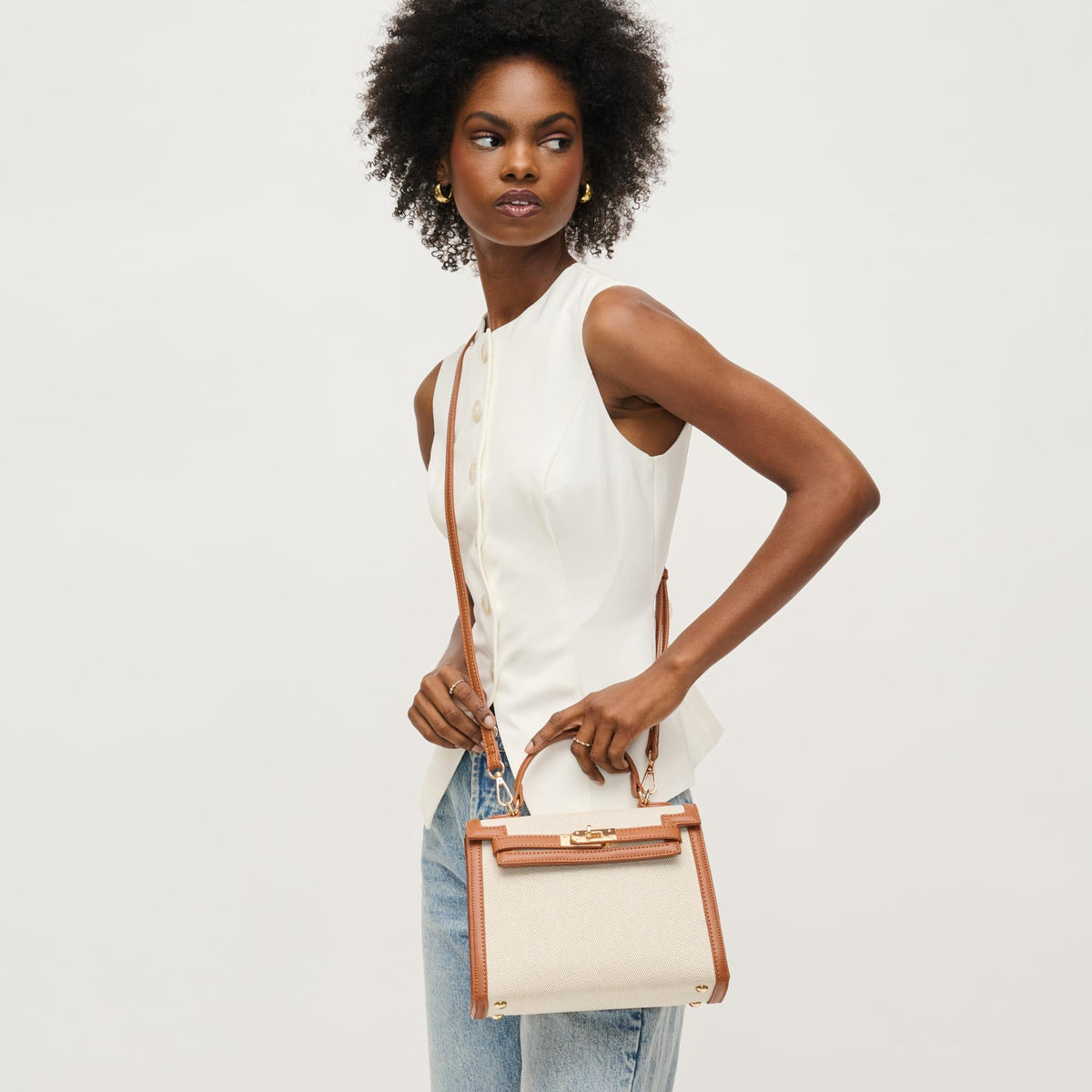 Woman wearing Tan Ivory Urban Expressions Cher Clutch 840611146311 View 3 | Tan Ivory