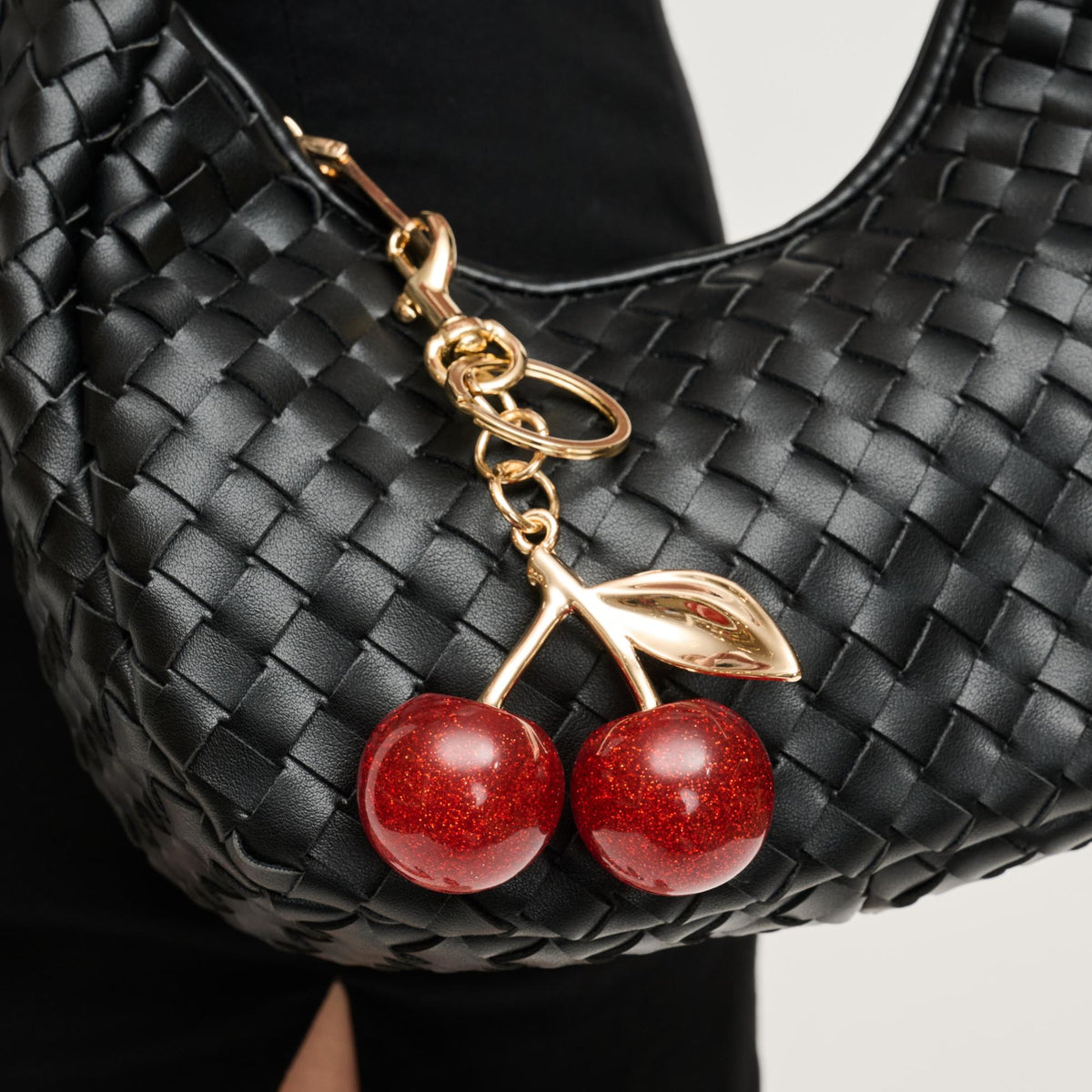 Woman wearing Cherry Urban Expressions Fay Keychain Charm 840611150585 View 1 | Cherry