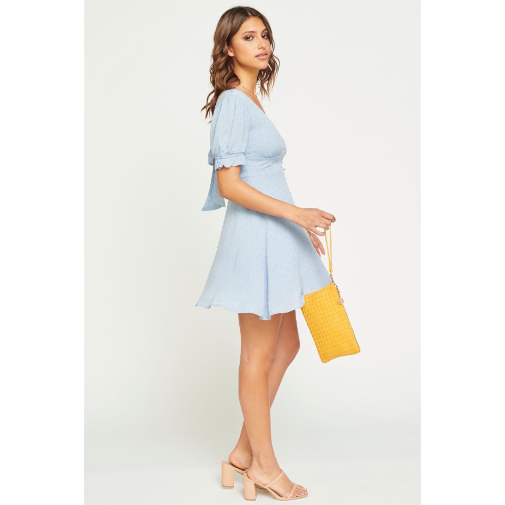 Woman wearing Mustard Urban Expressions Joan Wristlet NA-840611160478 View 3 | Mustard