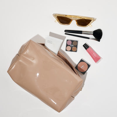 Woman wearing Nude Urban Essentials Patent Pending Cosmetic & Travel Organizer Pouch 840611197306 View 1 | Nude