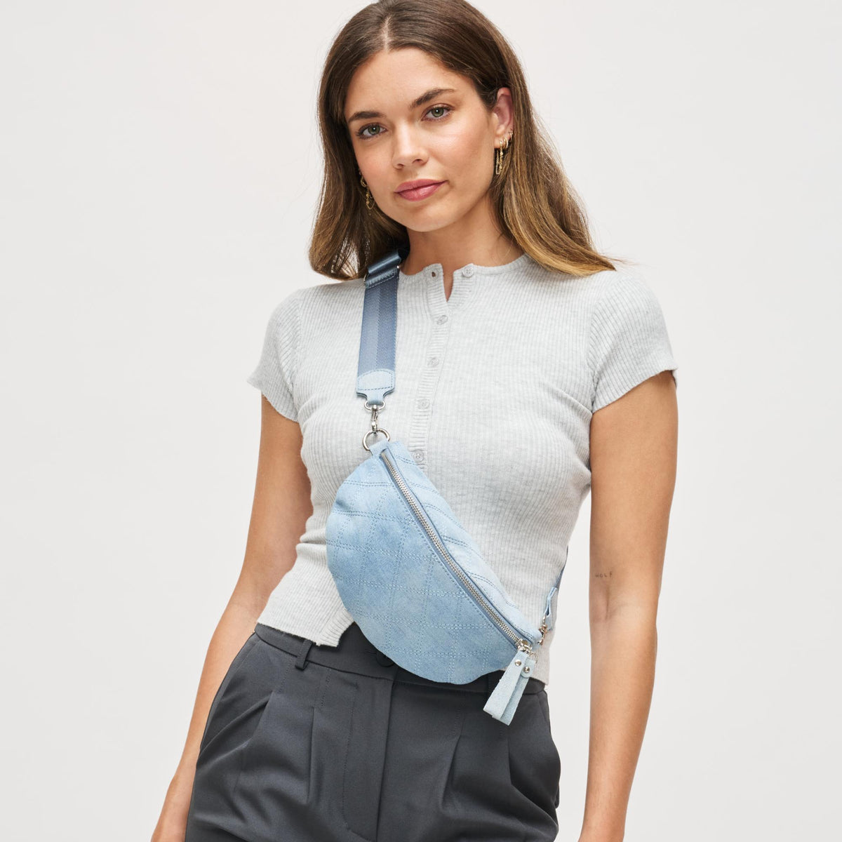 Woman wearing Blue Urban Expressions Lachlan - Quilted Belt Bag 840504200243 View 1 | Blue