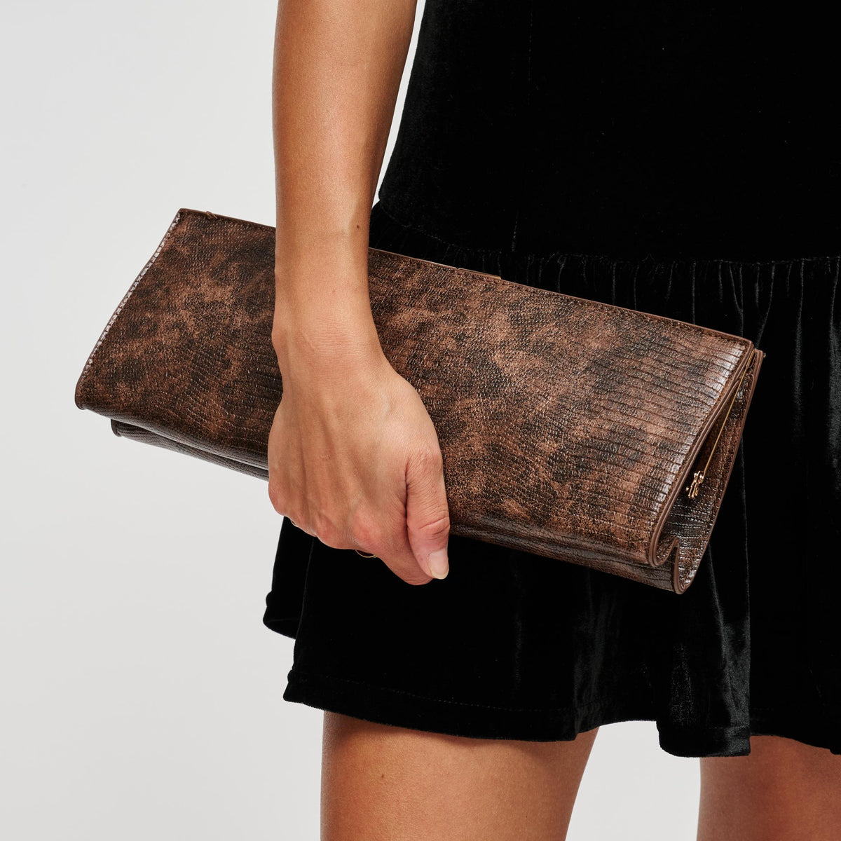 Woman wearing Brown Urban Expressions Nazlee - Lizard Clutch 840504212642 View 1 | Brown