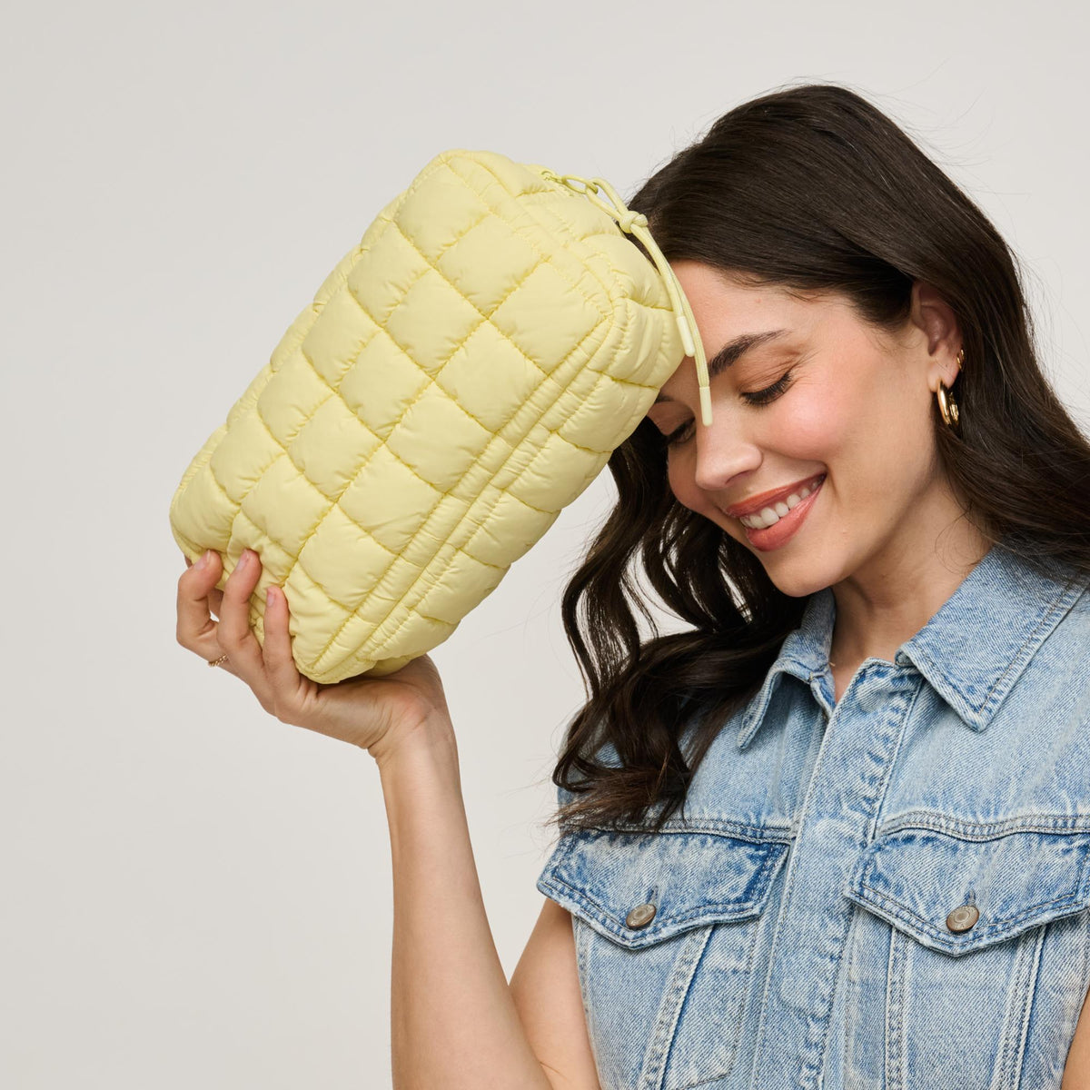 Woman wearing Butter Urban Essentials Cloud Nine - Puffer Cosmetic & Travel Organizer Pouch 840611143792 View 2 | Butter