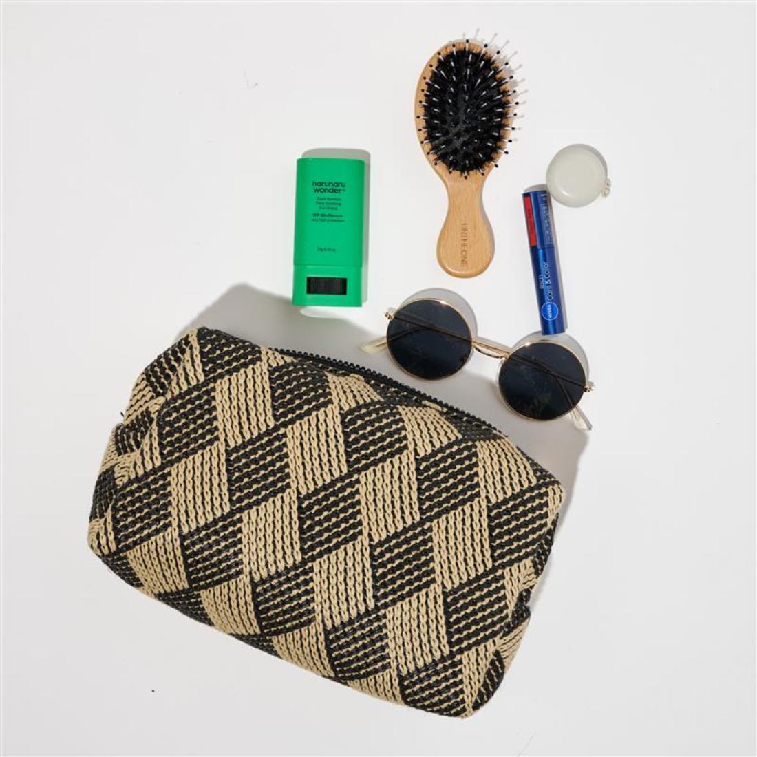 Woman wearing Black Natural Urban Essentials Bali Breeze Cosmetic & Travel Organizer Pouch 840611197726 View 1 | Black Natural