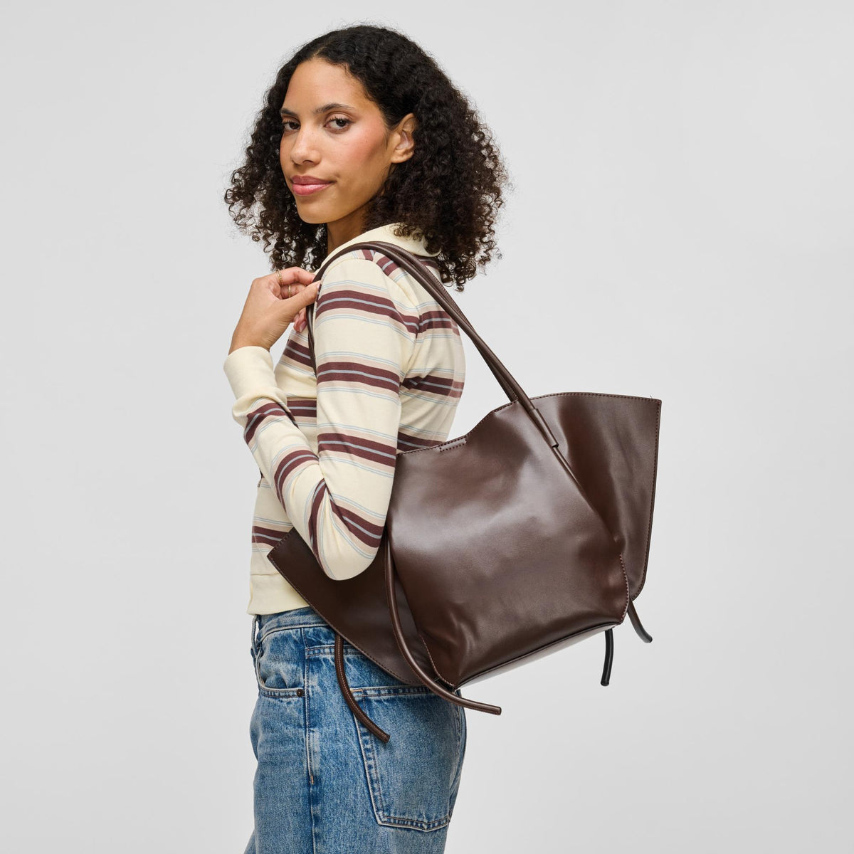 Woman wearing Chocolate Urban Expressions Caspien Tote 840504213267 View 1 | Chocolate