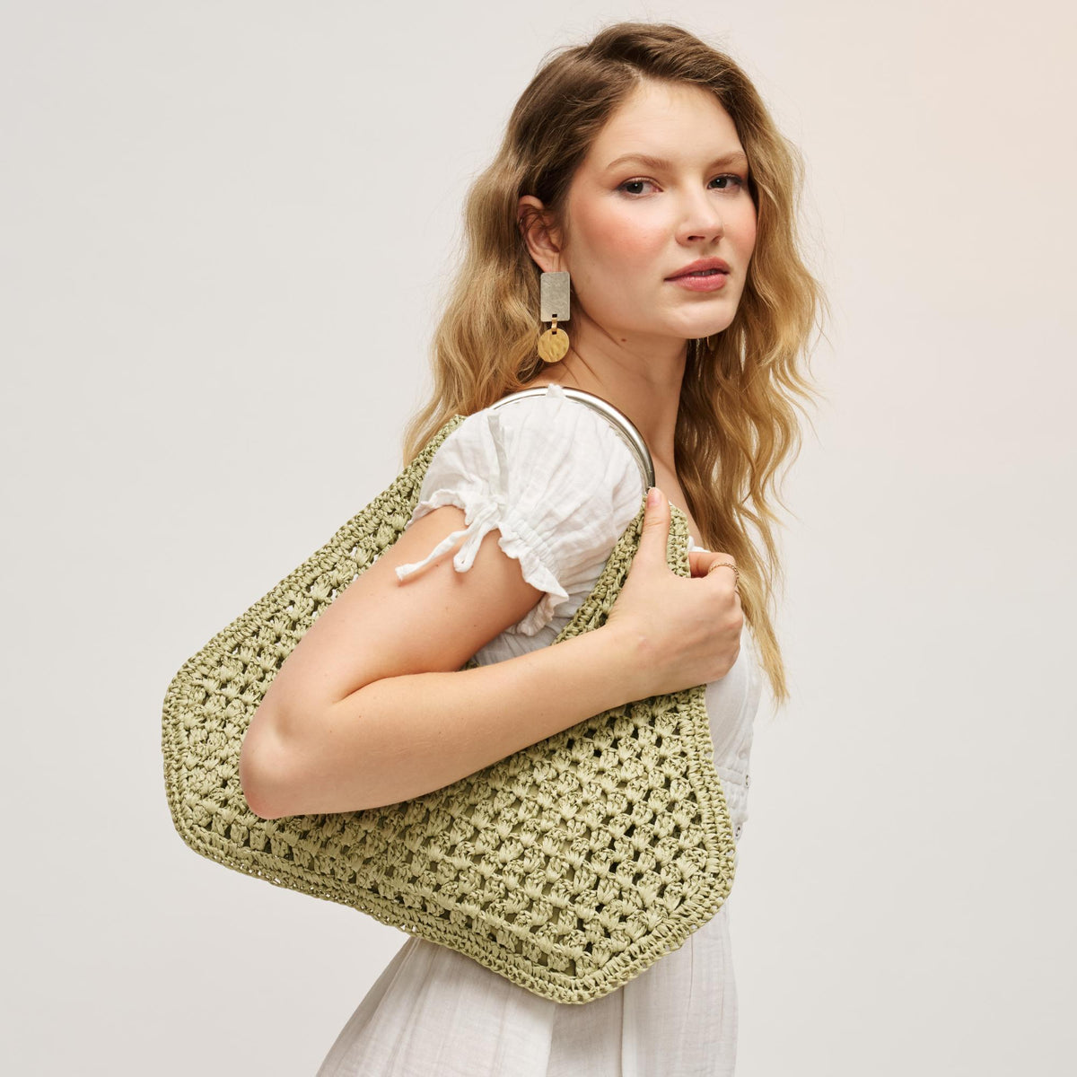 Woman wearing Sage Urban Expressions Iris Hobo 840504204852 View 3 | Sage