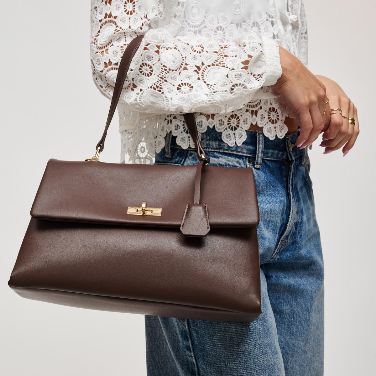 Woman wearing Espresso Urban Expressions Arrow Satchel 840504212932 View 2 | Espresso
