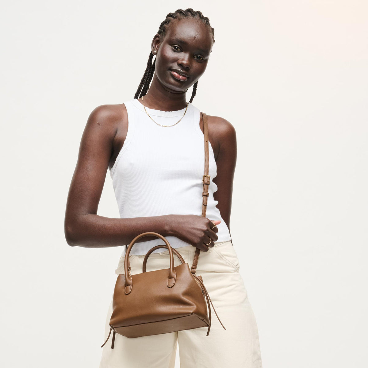 Woman wearing Chocolate Urban Expressions Logan Crossbody 840504205361 View 3 | Chocolate