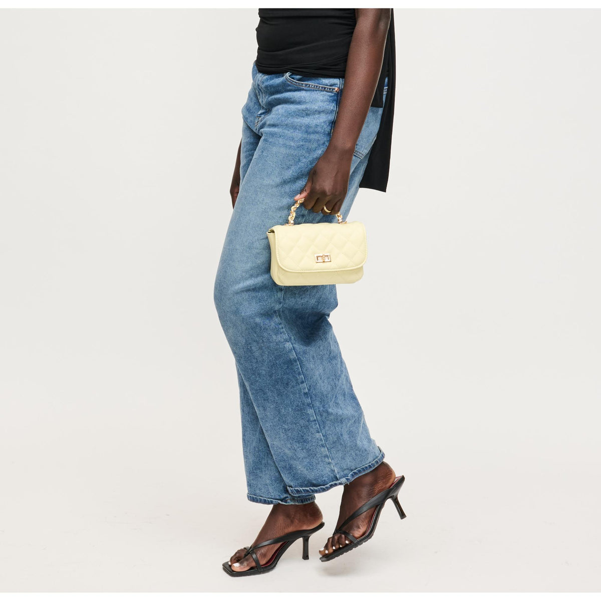 Woman wearing Butter Urban Expressions Leo Crossbody 840504205095 View 2 | Butter