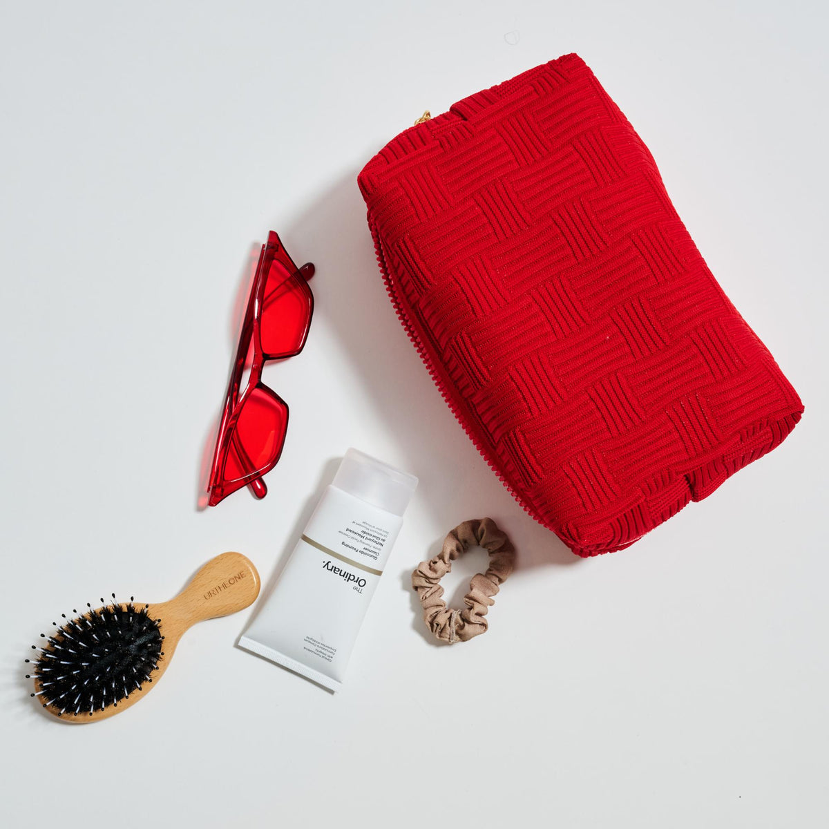 Woman wearing Red Urban Essentials Hatchway Cosmetic & Travel Organizer Pouch 840611197764 View 1 | Red