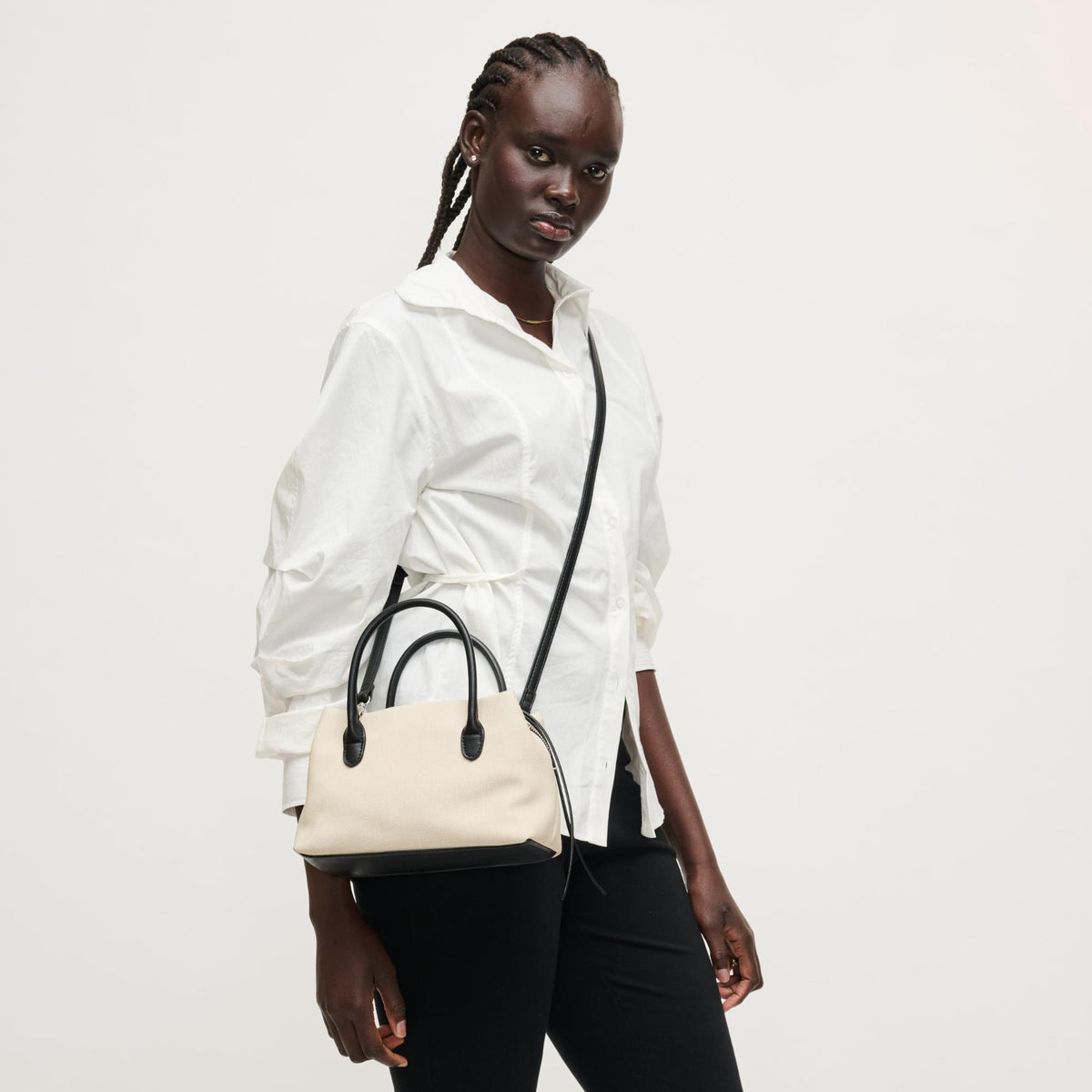 Woman wearing Ivory Black Urban Expressions Logan Crossbody 840504205330 View 3 | Ivory Black
