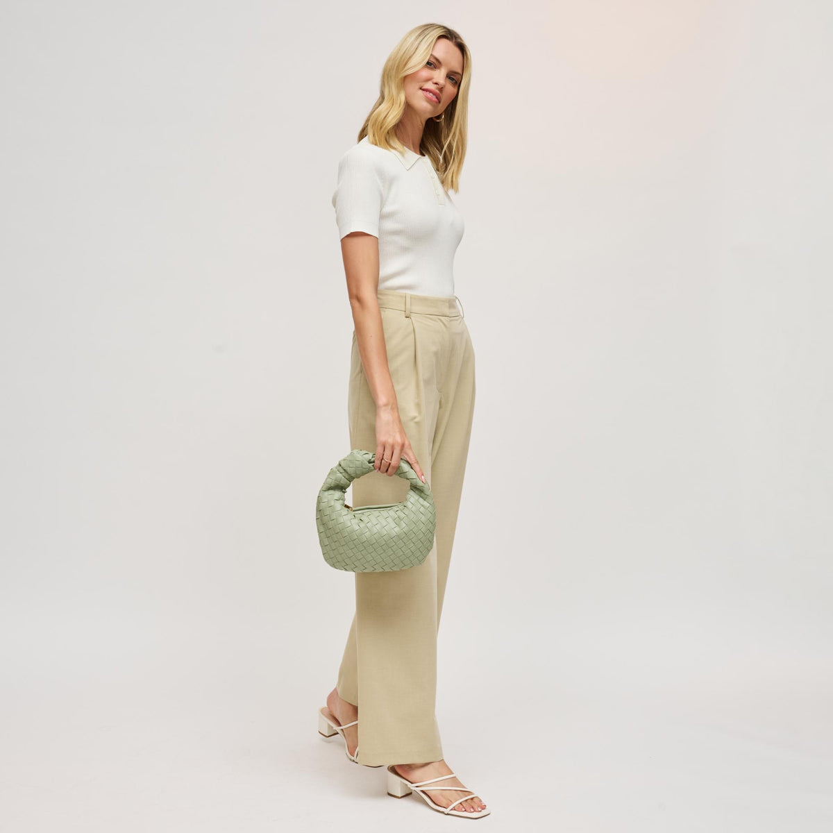 Woman wearing Sage Urban Expressions Tracy - Woven Clutch 840611141637 View 4 | Sage
