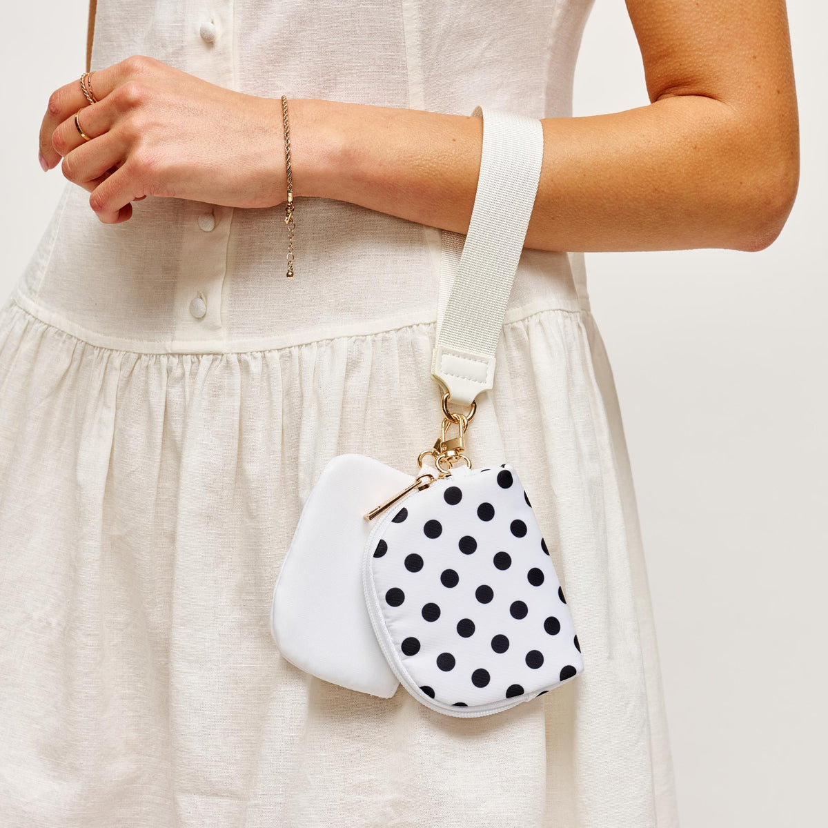 Woman wearing White Urban Expressions Link & Carry - Polka Dot Wristlet 840504202735 View 2 | White